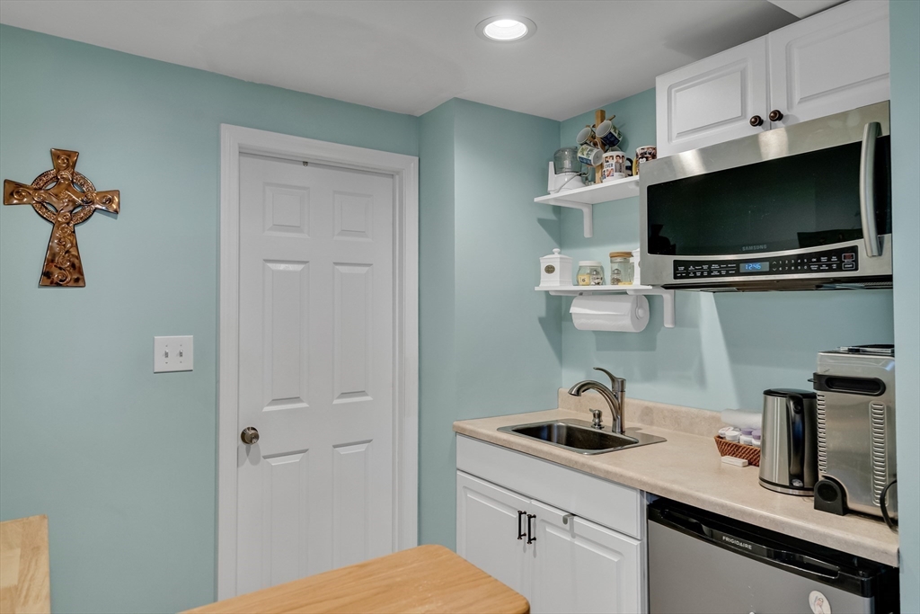 7 Long Terrace Boston, MA 02132 - Photo 34 of 42 a kitchen with a sink and a microwave