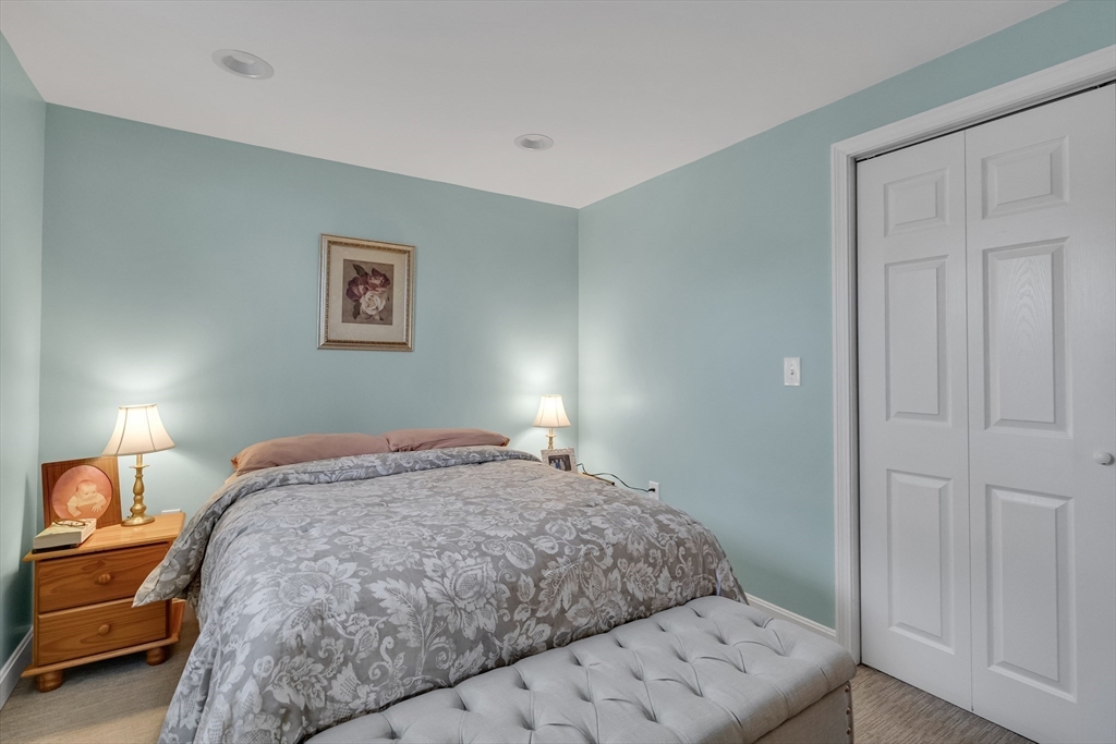 7 Long Terrace Boston, MA 02132 - Photo 36 of 42 a bedroom with a bed and a lamp