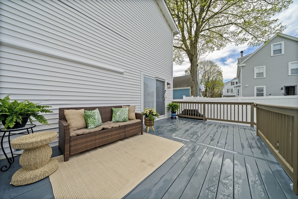 7 Long Terrace Boston, MA 02132 - Photo 39 of 42 a view of a wooden deck with a bench