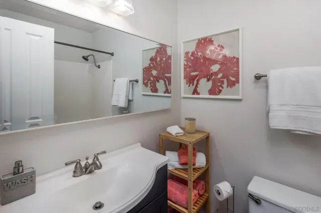 an aerial view of a tennis ground and a big yard