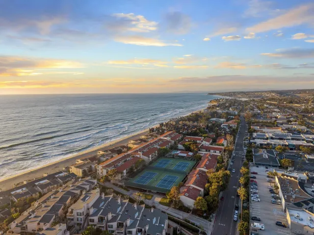 a living room with furniture fireplace and flat screen tv