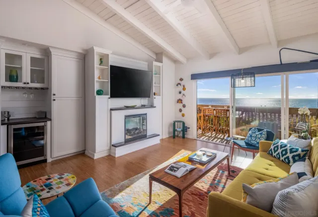 a view of a balcony with an outdoor seating