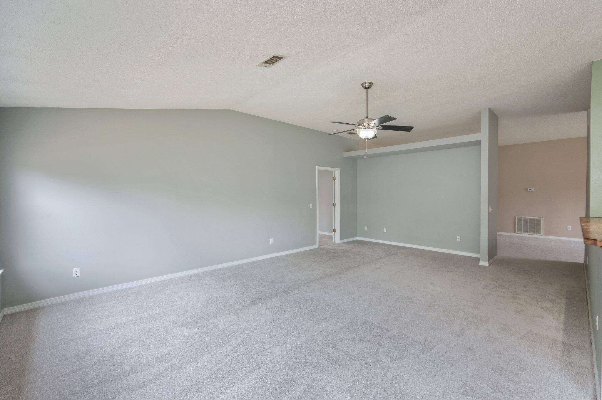 488 Jillian Drive Crestview, FL 32536 - Photo 13 of 29 a view of an empty room with a chandelier fan