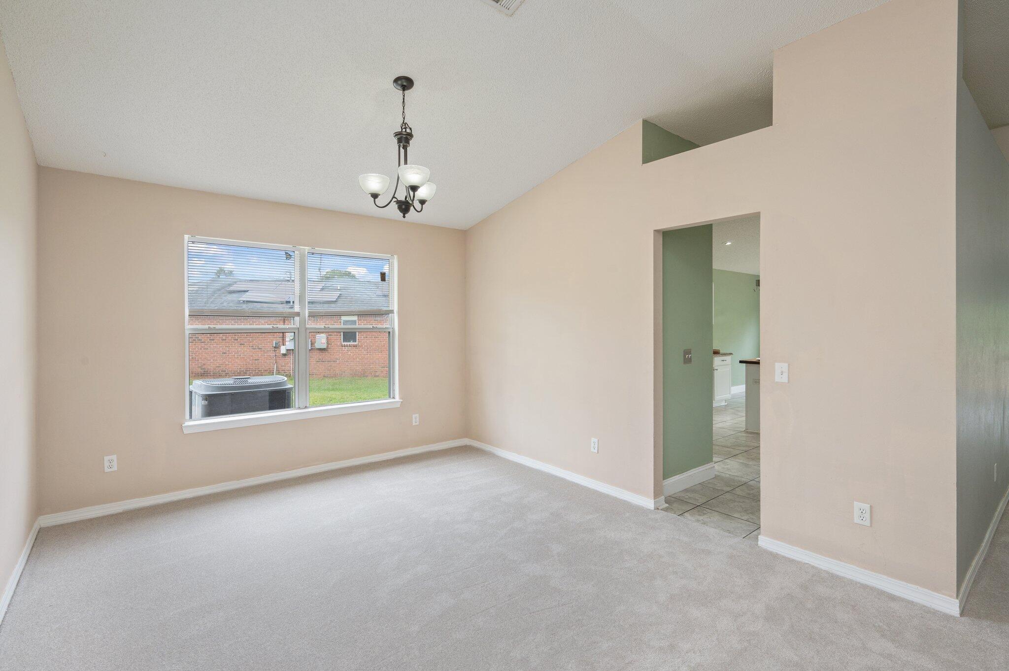 488 Jillian Drive Crestview, FL 32536 - Photo 15 of 29 an empty room with windows and outdoor view