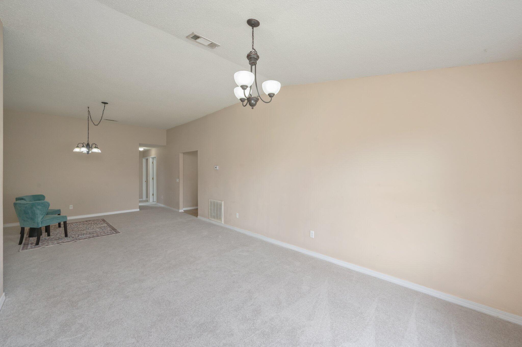 488 Jillian Drive Crestview, FL 32536 - Photo 16 of 29 wooden floor in an empty room with a window