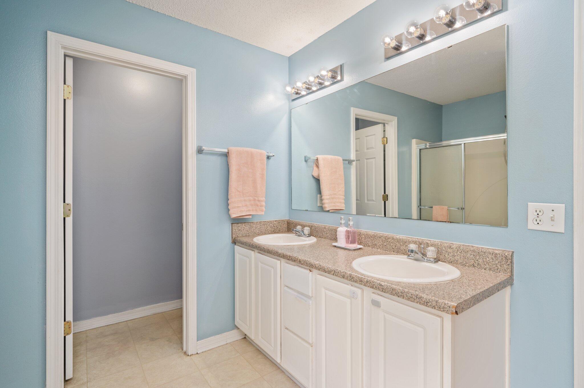 488 Jillian Drive Crestview, FL 32536 - Photo 22 of 29 a bathroom with a sink double vanity and a mirror