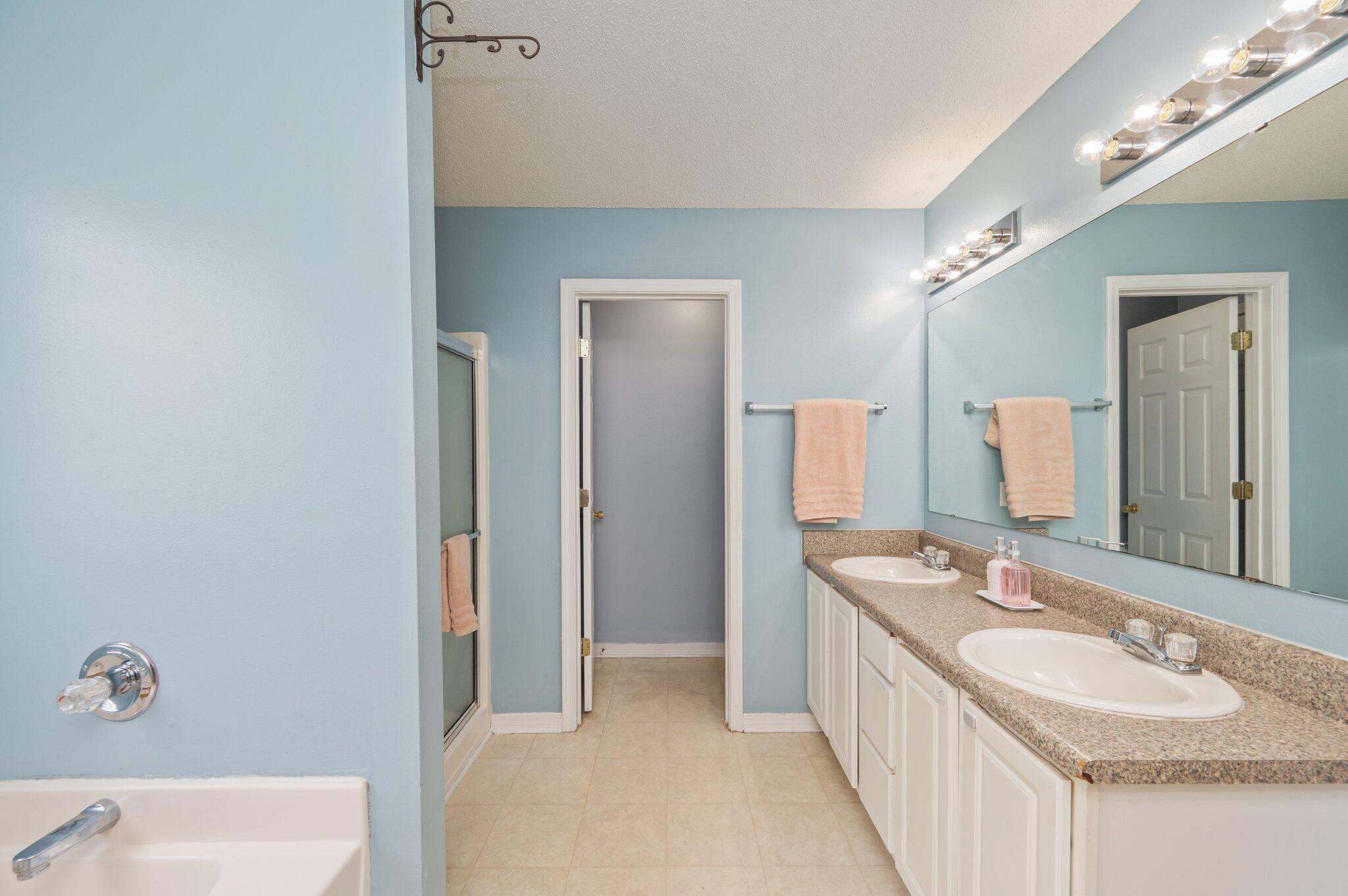 488 Jillian Drive Crestview, FL 32536 - Photo 25 of 29 a bathroom with a double vanity sink and a mirror