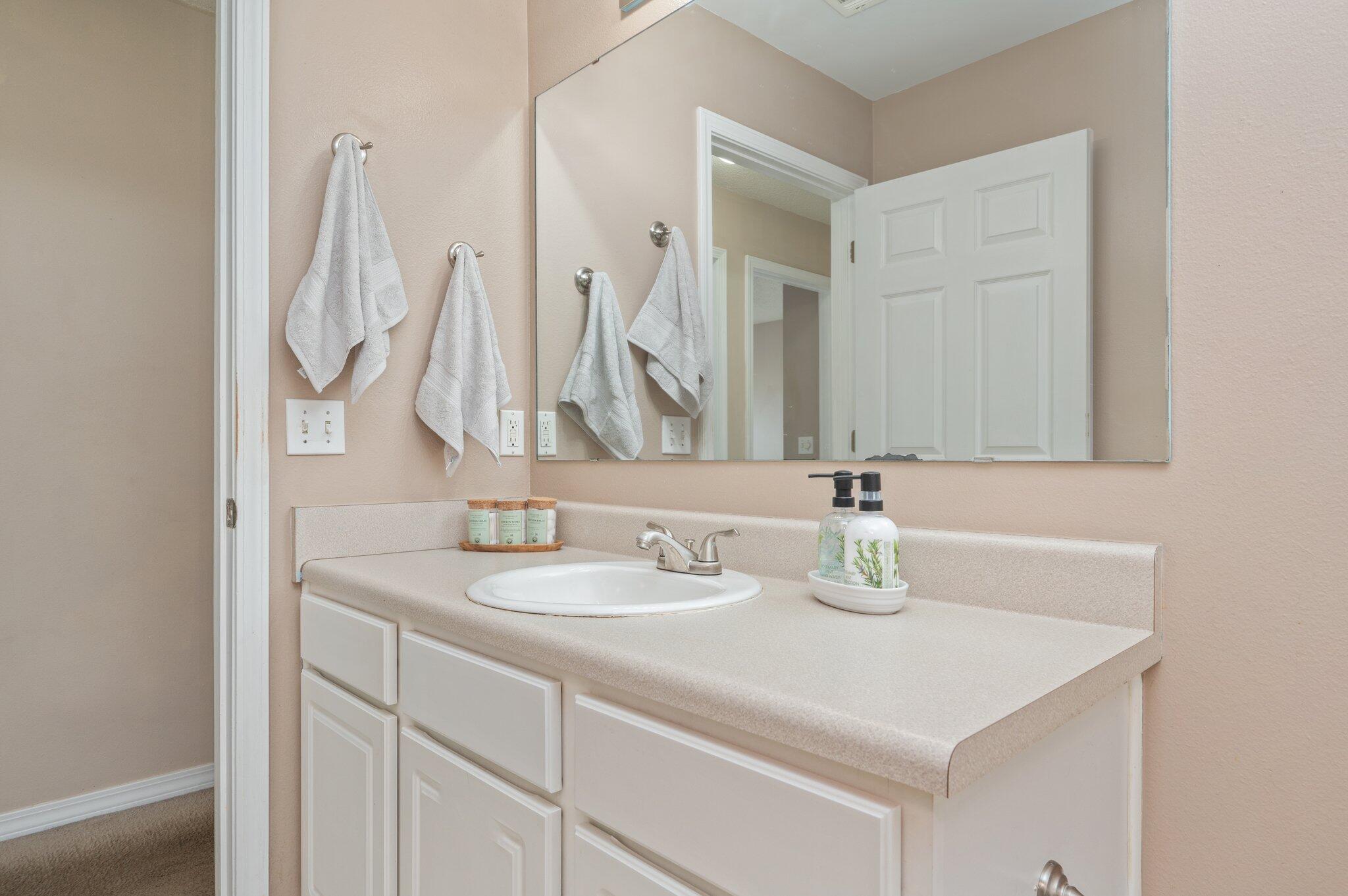 488 Jillian Drive Crestview, FL 32536 - Photo 26 of 29 a bathroom with double vanity sink and a mirror