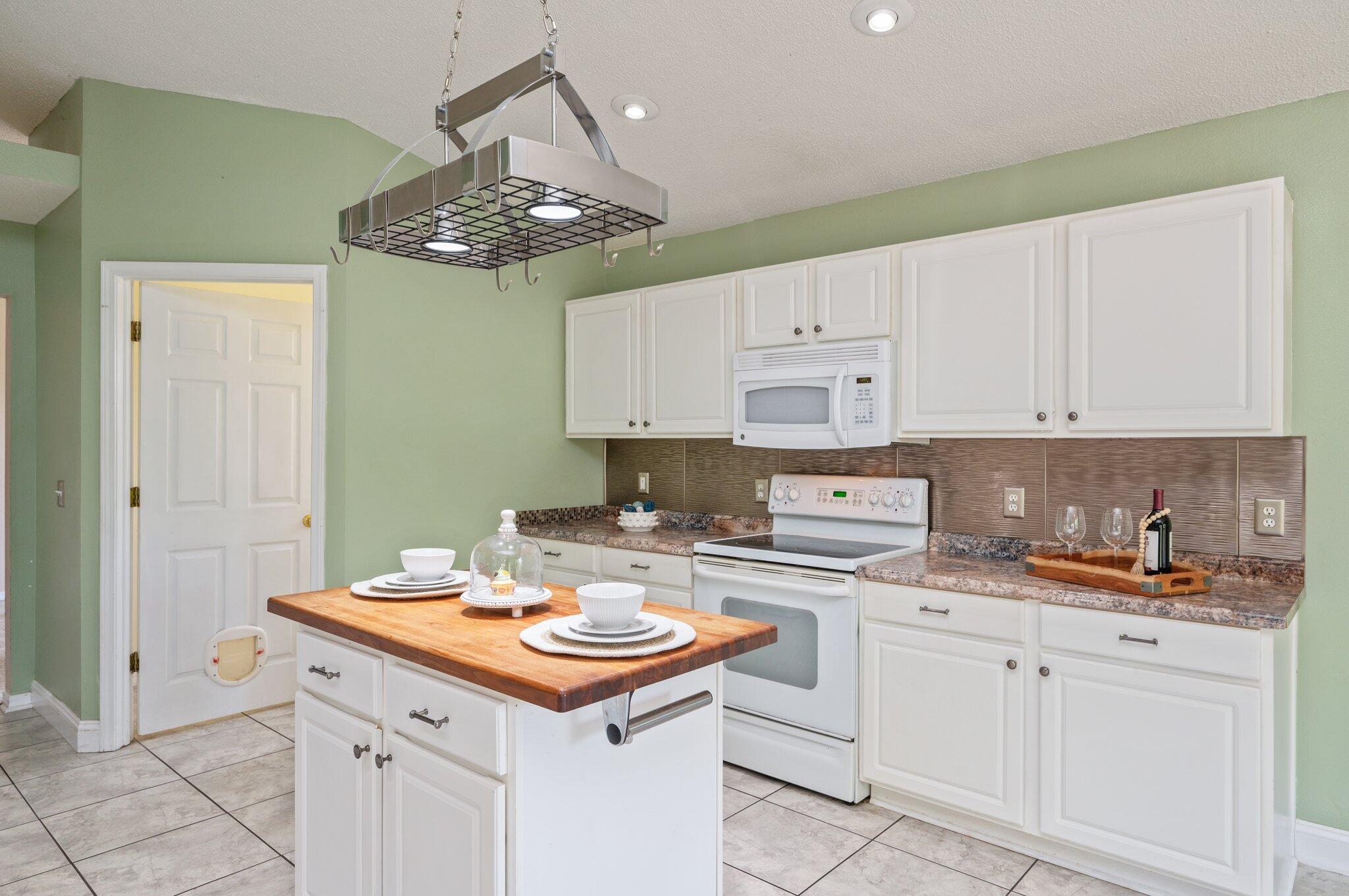 488 Jillian Drive Crestview, FL 32536 - Photo 6 of 29 a kitchen with a sink stove and cabinets
