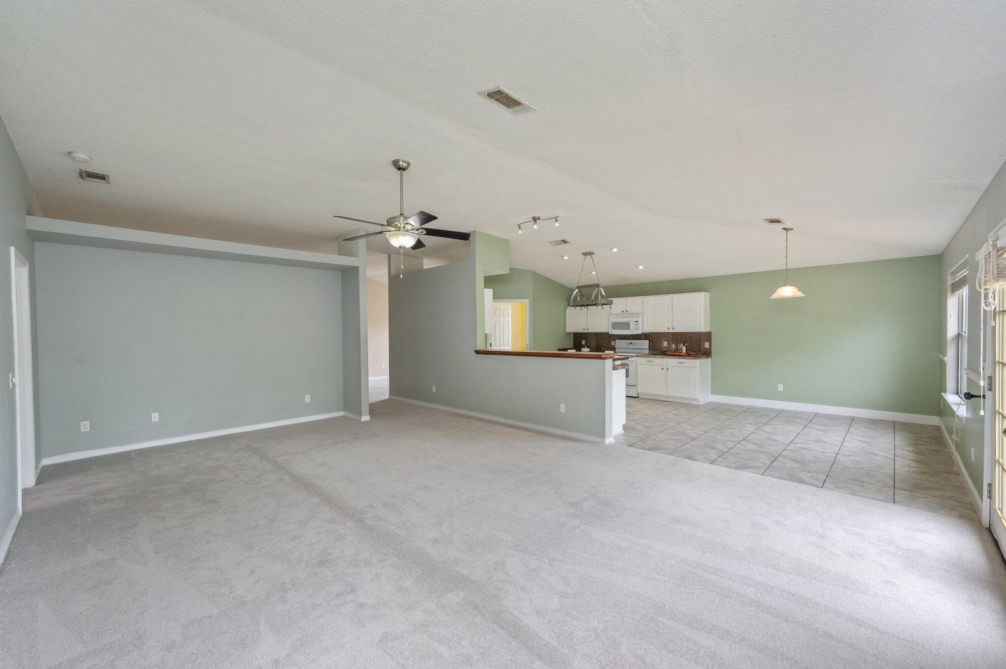 488 Jillian Drive Crestview, FL 32536 - Photo 10 of 29 a view of a kitchen with a sink and a refrigerator