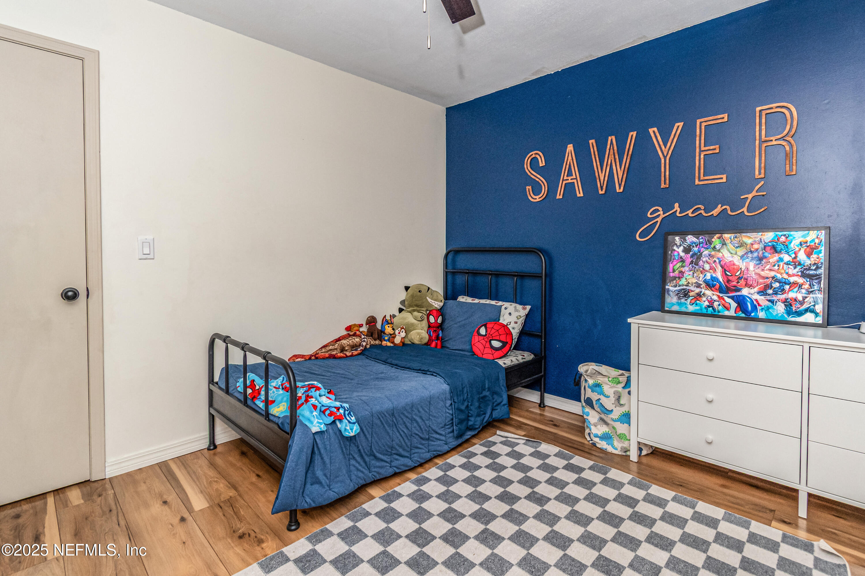 311 North 4th Street Macclenny, FL 32063 - Photo 15 of 35 a bedroom with a bed and a dresser