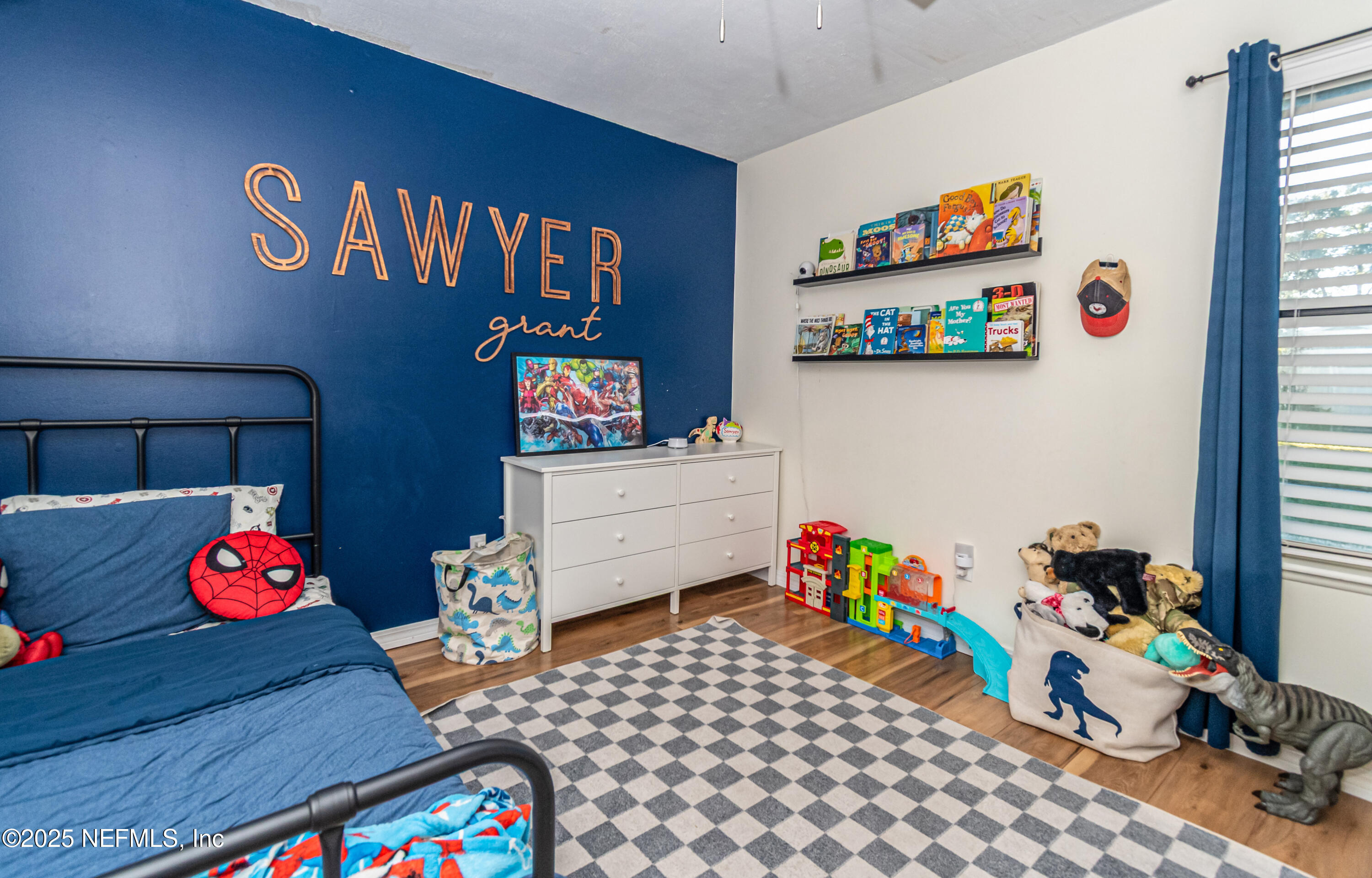 311 North 4th Street Macclenny, FL 32063 - Photo 16 of 35 a bedroom with toys and a book shelf