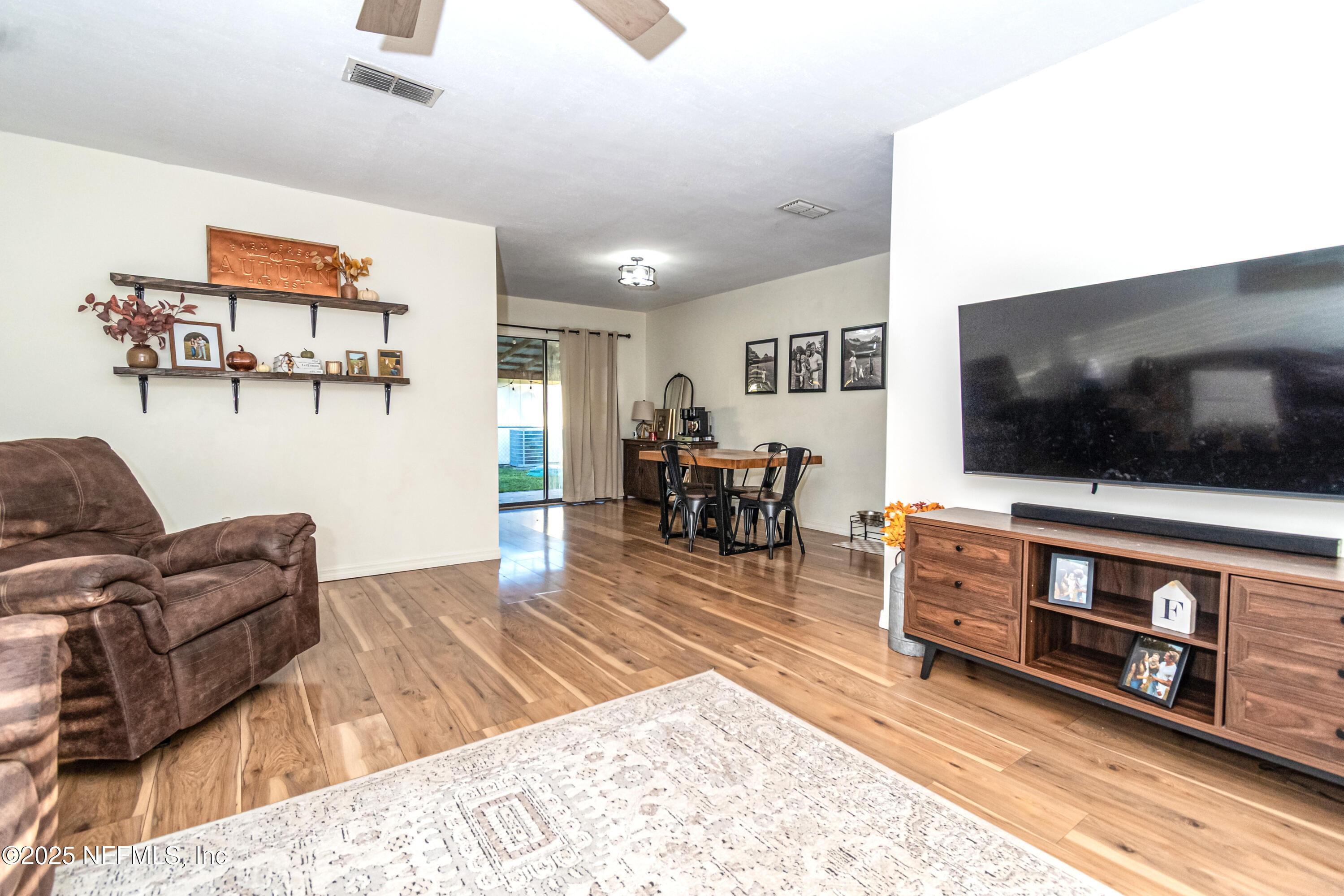 311 North 4th Street Macclenny, FL 32063 - Photo 20 of 35 a living room with furniture and a flat screen tv