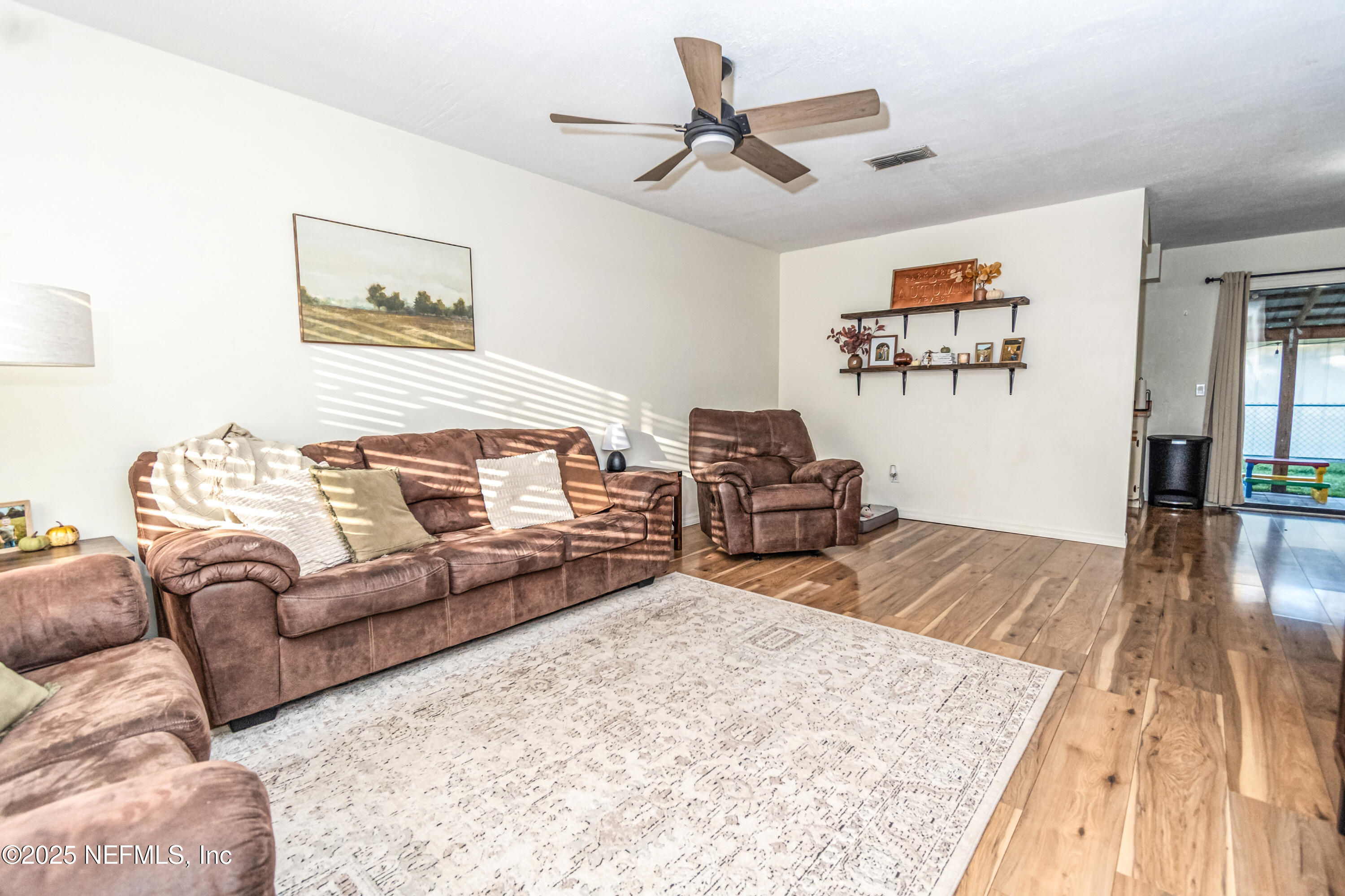 311 North 4th Street Macclenny, FL 32063 - Photo 21 of 35 a living room with furniture and a wooden floor