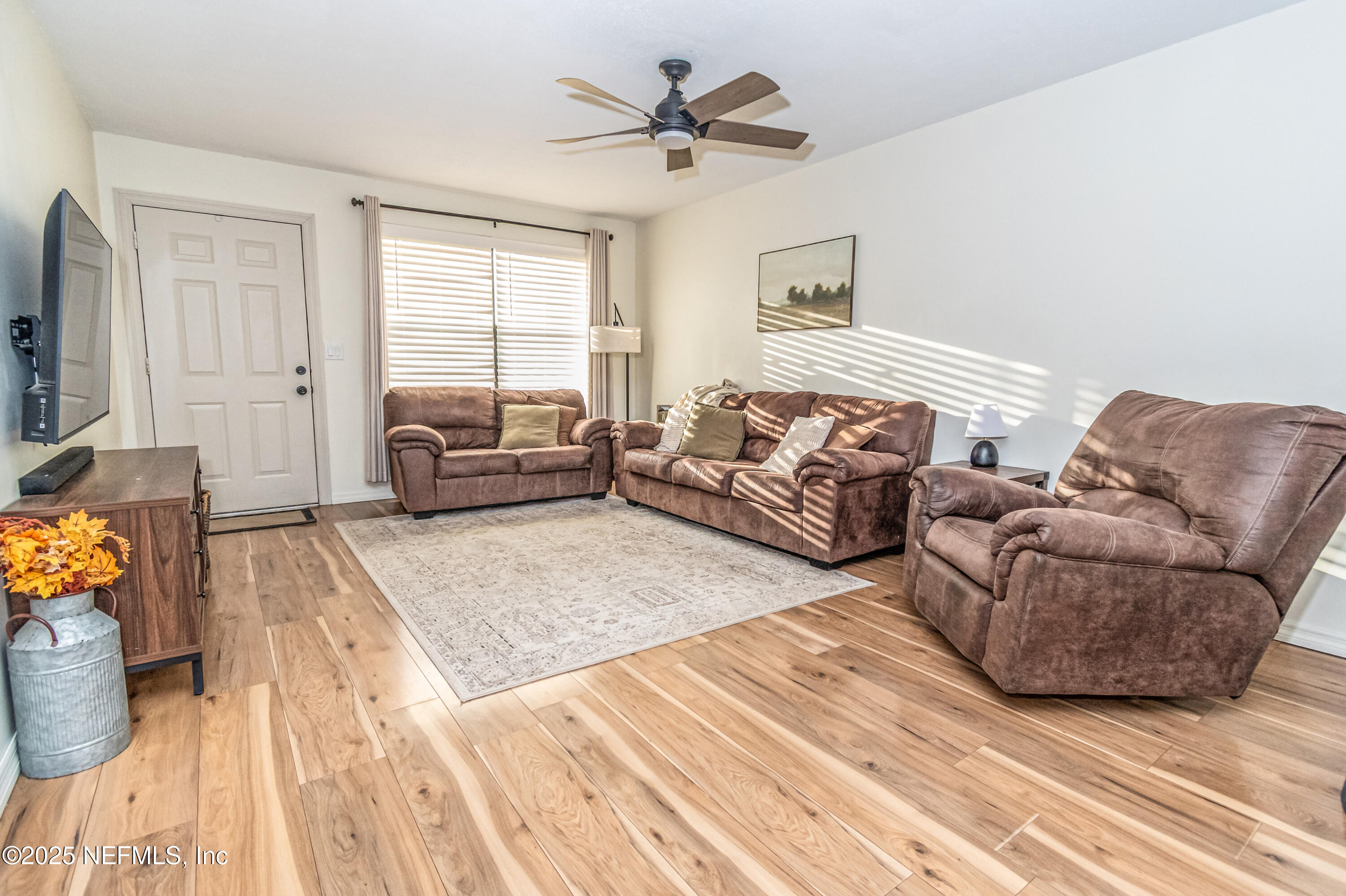 311 North 4th Street Macclenny, FL 32063 - Photo 22 of 35 a living room with furniture and a wooden floor