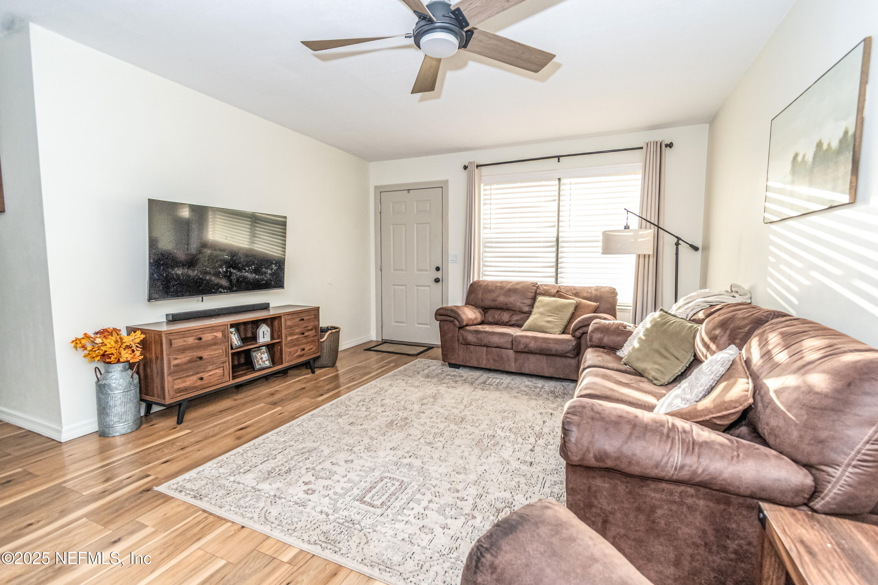 311 North 4th Street Macclenny, FL 32063 - Photo 23 of 35 a living room with furniture and a flat screen tv