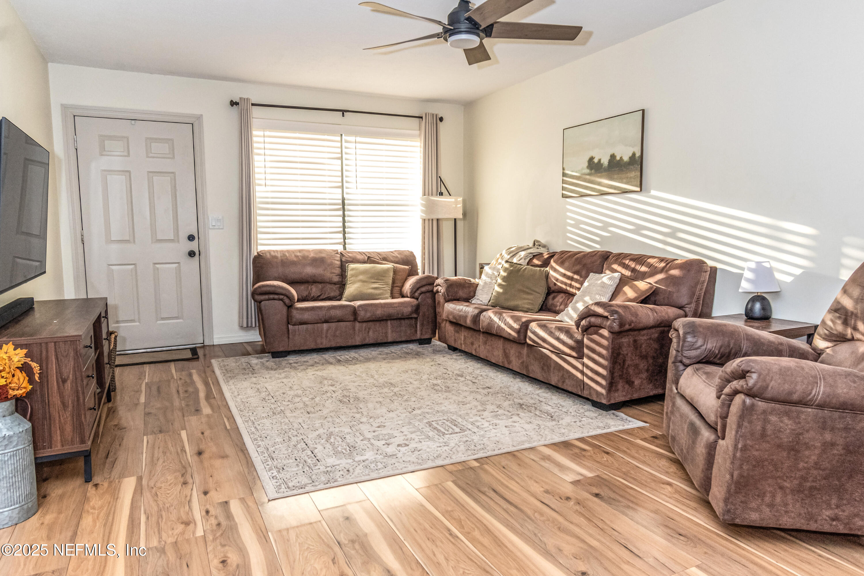 311 North 4th Street Macclenny, FL 32063 - Photo 24 of 35 a living room with furniture and a wooden floor