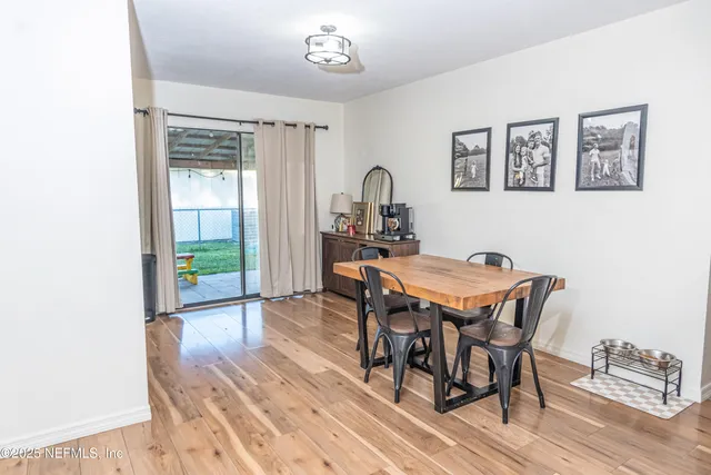 a dining room with a table and chairs