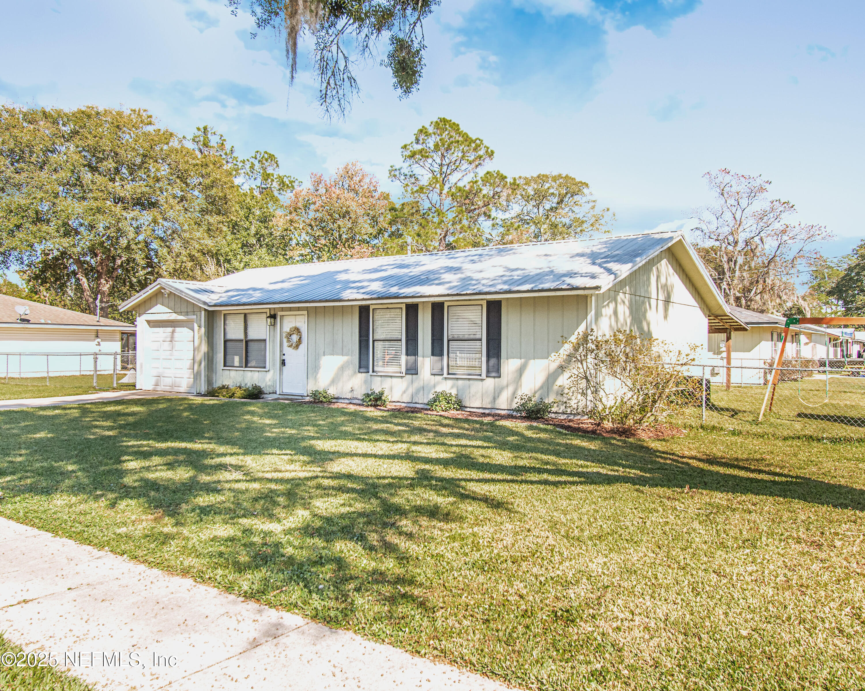 311 North 4th Street Macclenny, FL 32063 - Photo 4 of 35 a view of a house with a swimming pool