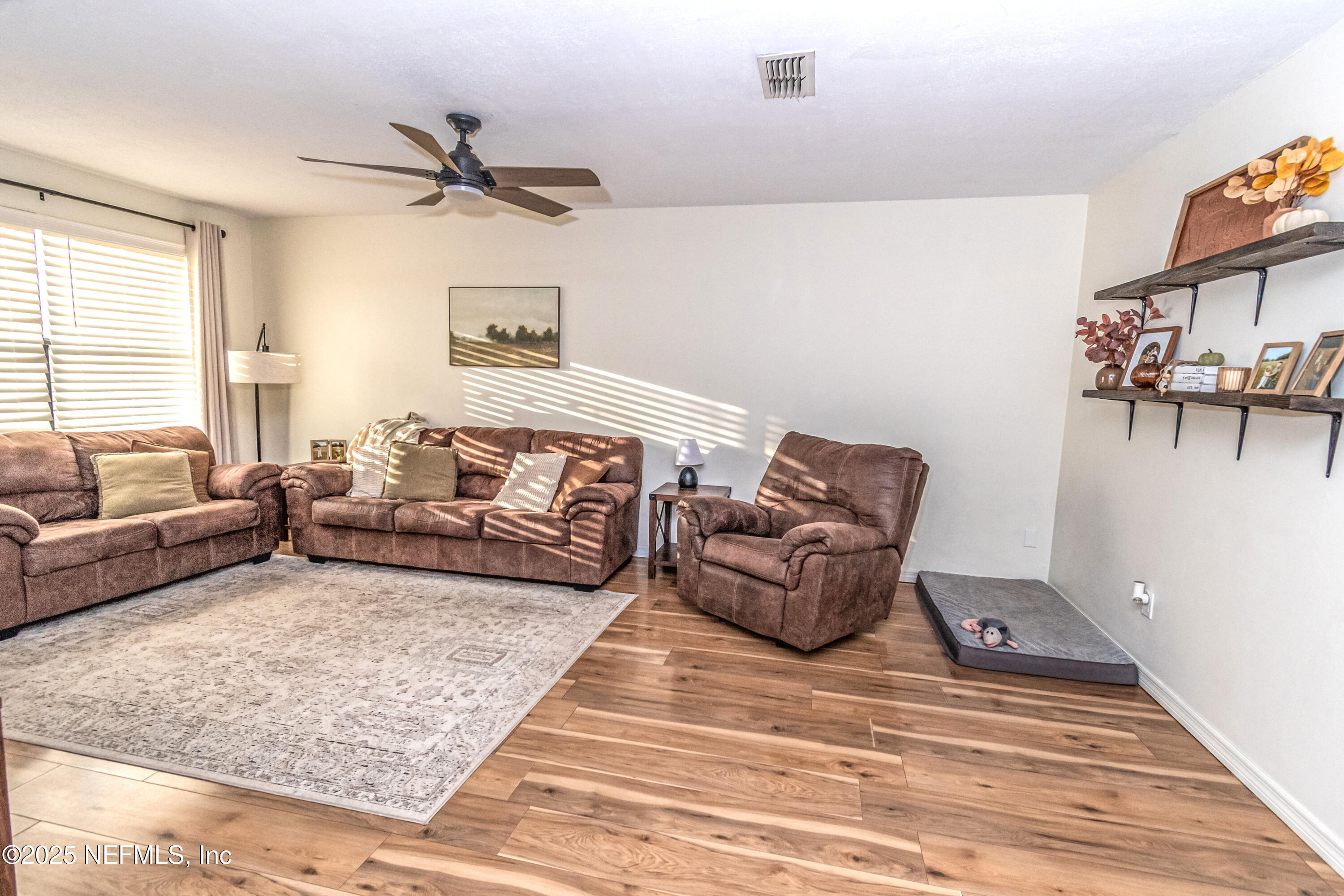 311 North 4th Street Macclenny, FL 32063 - Photo 5 of 35 a bedroom with furniture or couch and a window