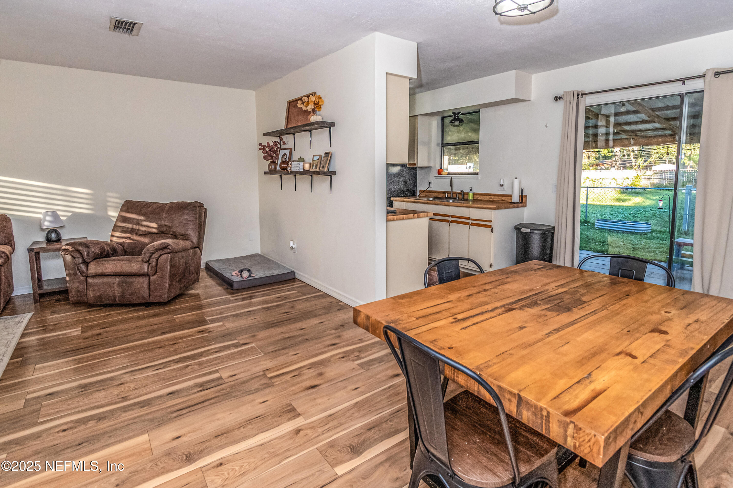 311 North 4th Street Macclenny, FL 32063 - Photo 6 of 35 a bed room with a bed and a television