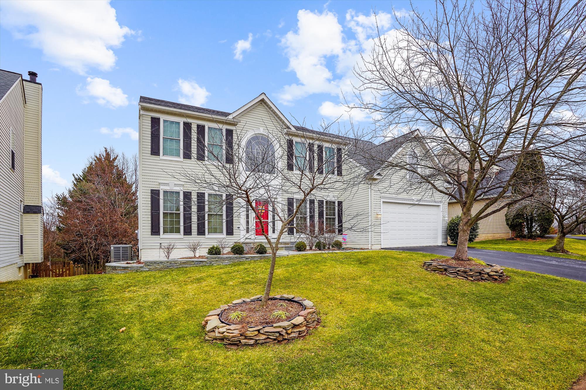 20702 Pomeroy Court Ashburn, VA 20147 - Photo 2 of 60 a front view of a house with a yard and garage