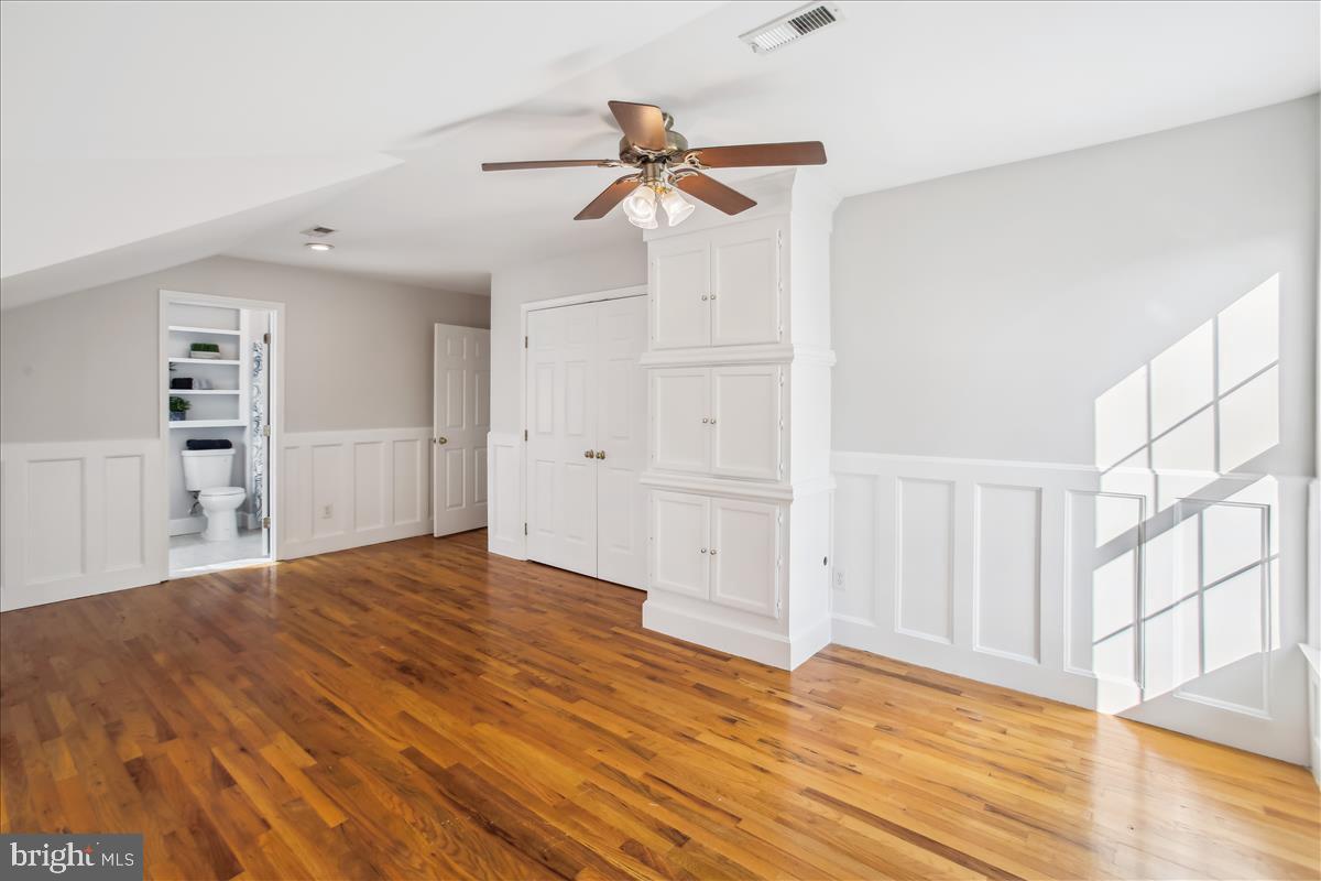20702 Pomeroy Court Ashburn, VA 20147 - Photo 32 of 60 a view of empty room with wooden floor and fan