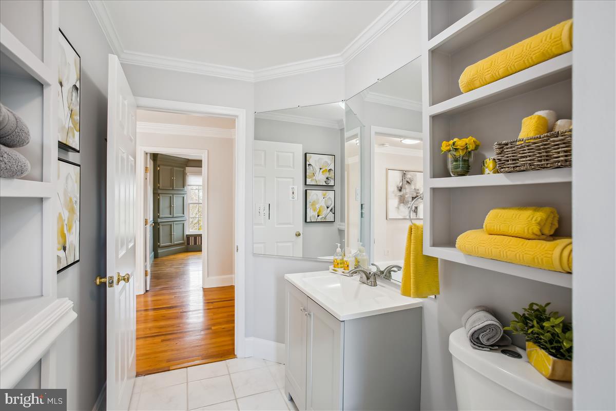 20702 Pomeroy Court Ashburn, VA 20147 - Photo 41 of 60 a bathroom with a sink mirror and vanity