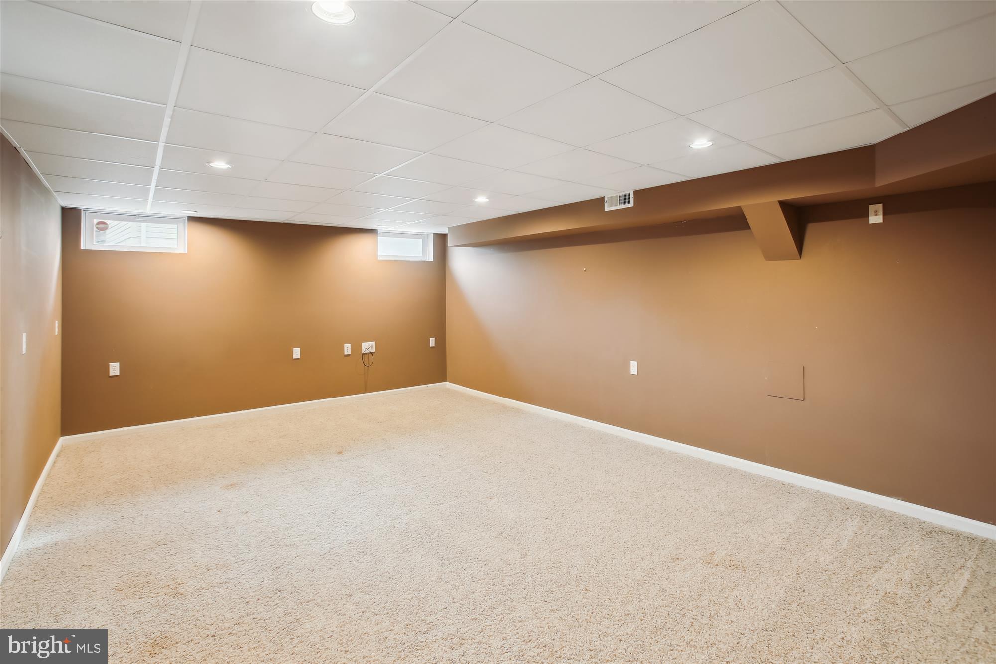 20702 Pomeroy Court Ashburn, VA 20147 - Photo 50 of 60 a view of a livingroom with a projector