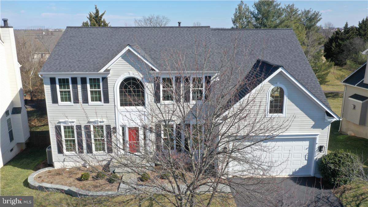 20702 Pomeroy Court Ashburn, VA 20147 - Photo 6 of 60 a view of a house with a yard