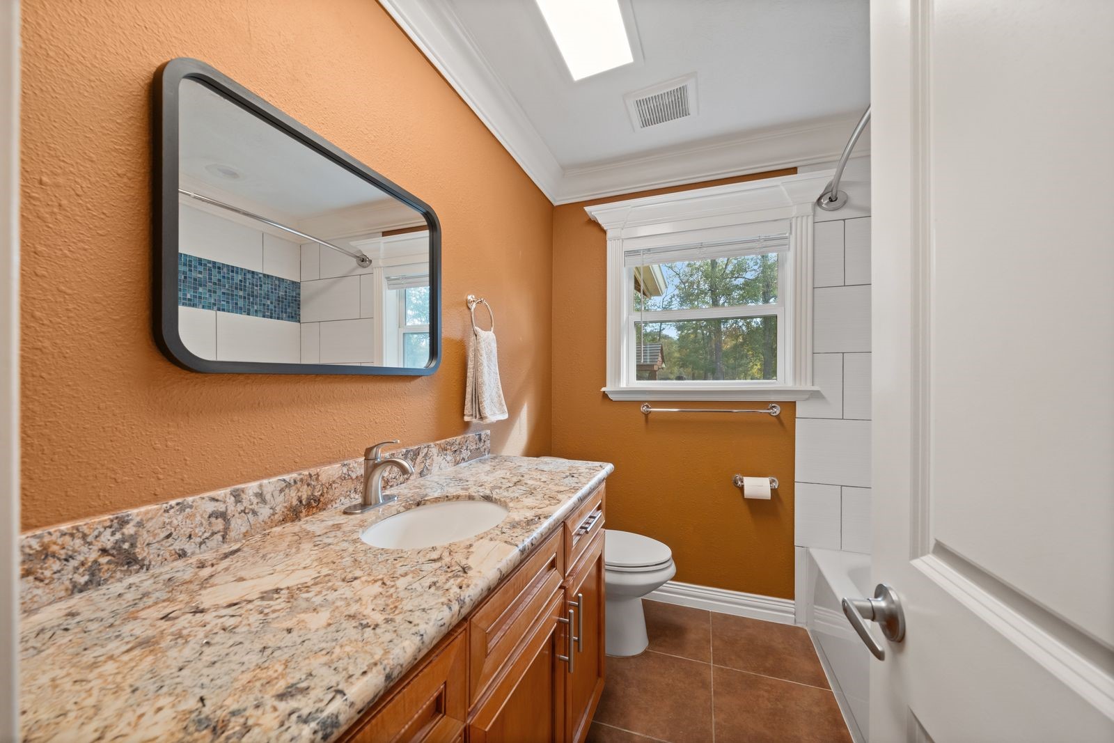 6742 Dusty Lane Conroe, TX 77306 - Photo 17 of 33 Full secondary bathroom with granite counter tops and a tub/shower combo.