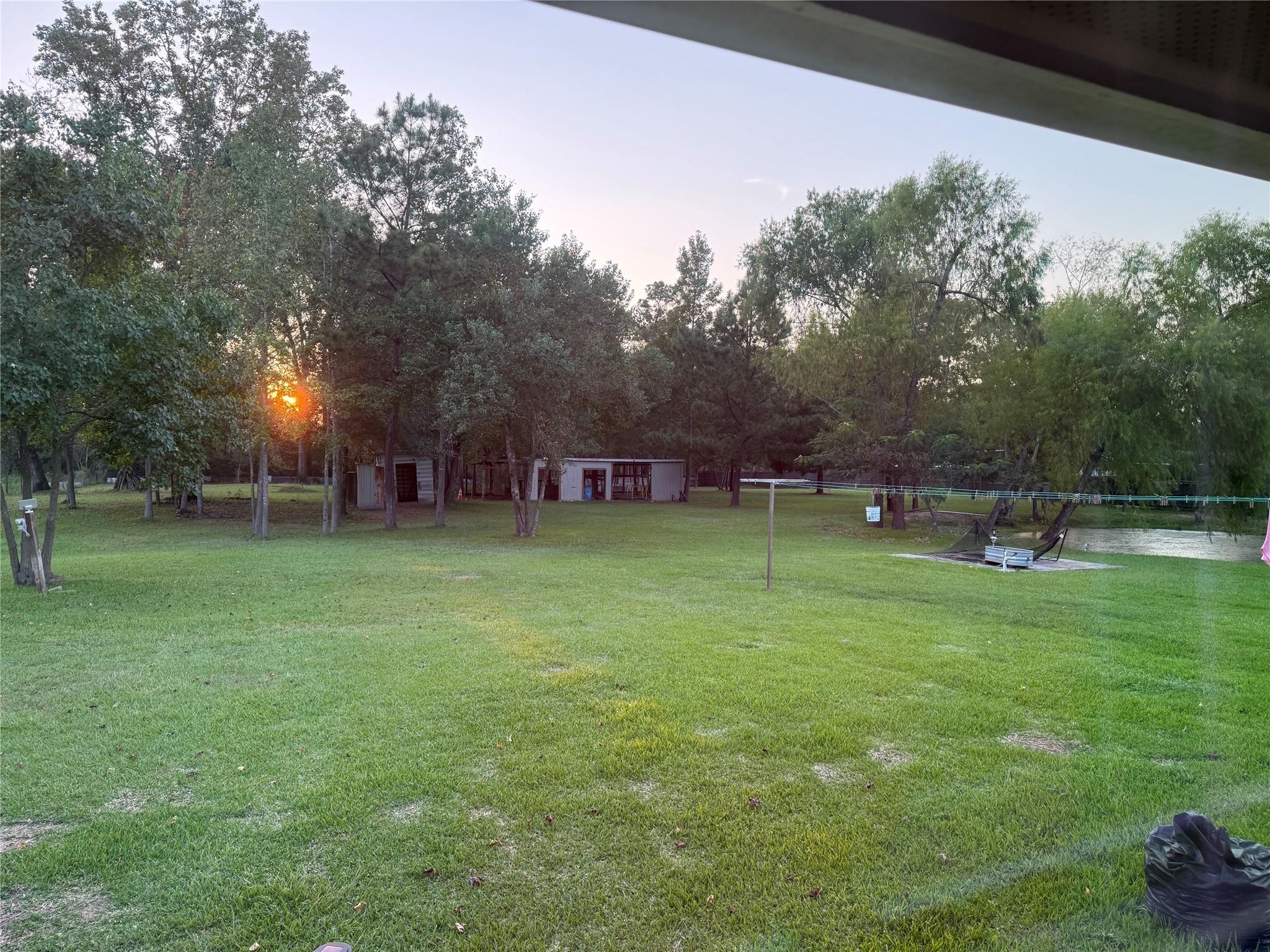 6742 Dusty Lane Conroe, TX 77306 - Photo 27 of 33 Sunset view from back of property.
