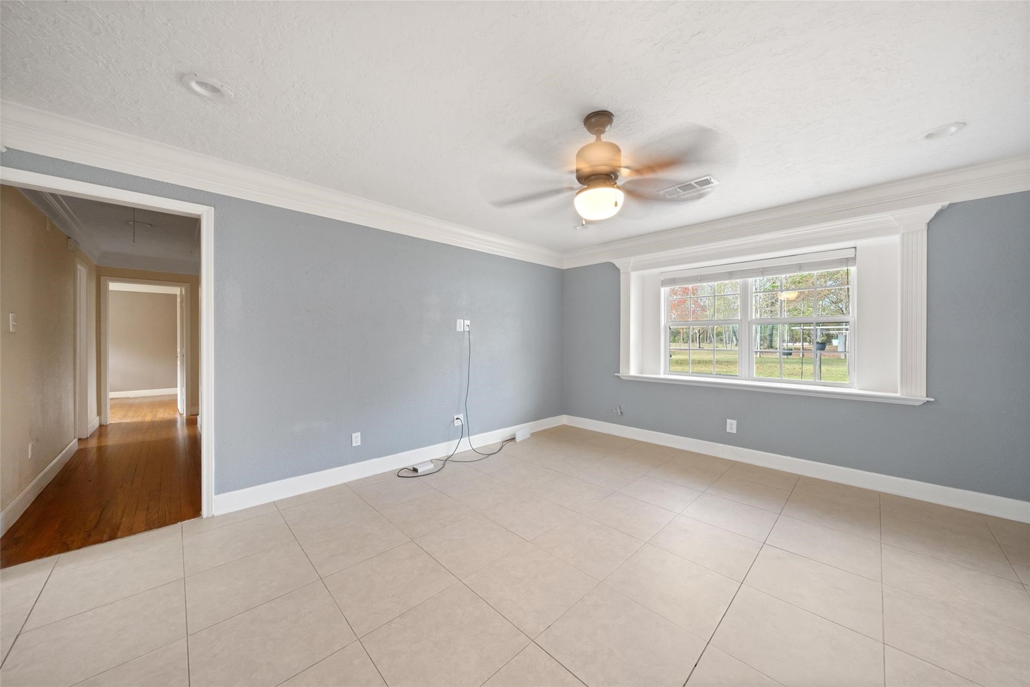 6742 Dusty Lane Conroe, TX 77306 - Photo 9 of 33 The living room has a nice window that allows for natural light and views of the property.