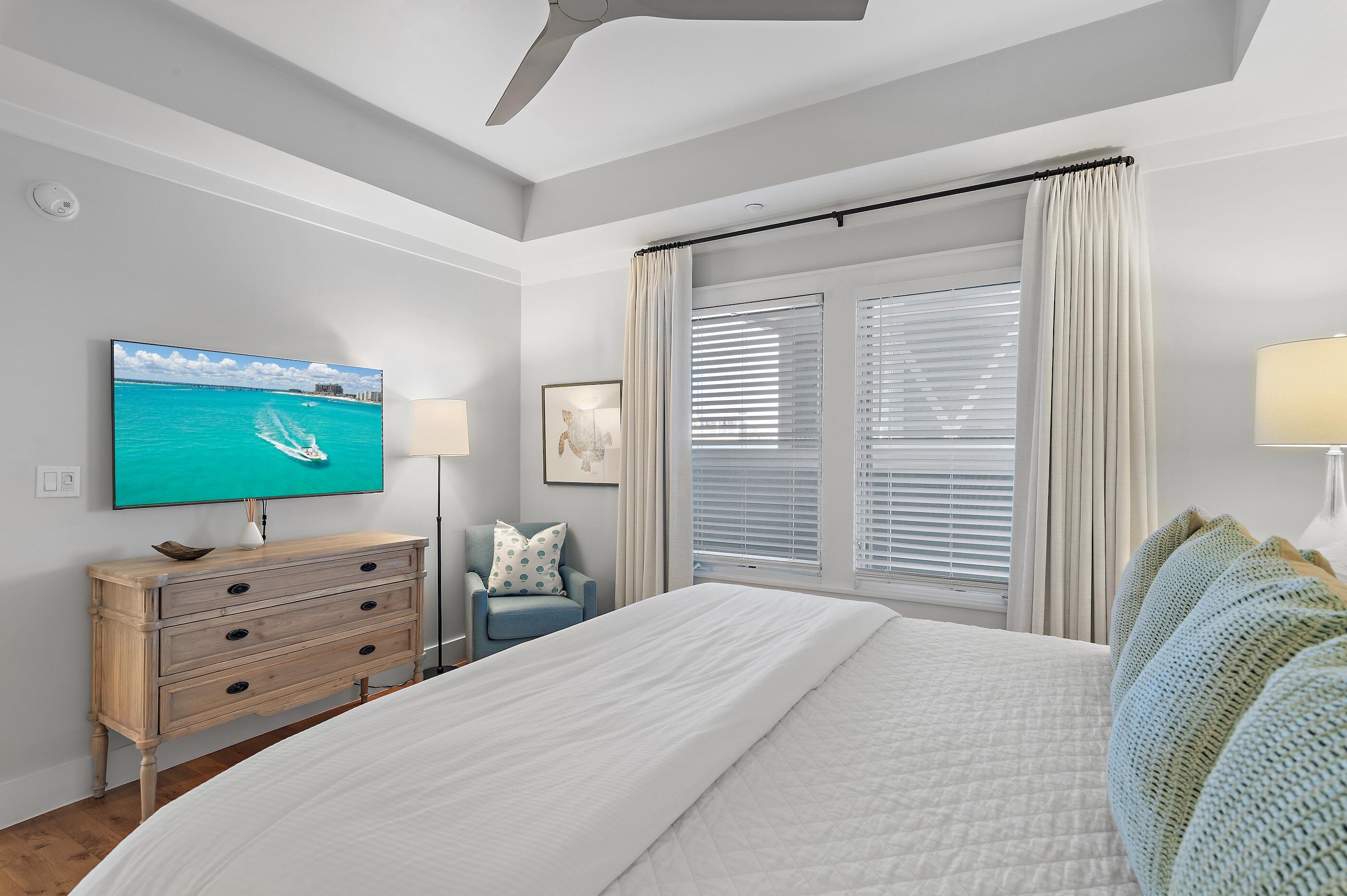 337 Bridge Lane, Unit 312B Watersound, FL 32461 - Photo 16 of 37 a bedroom with a bed and television