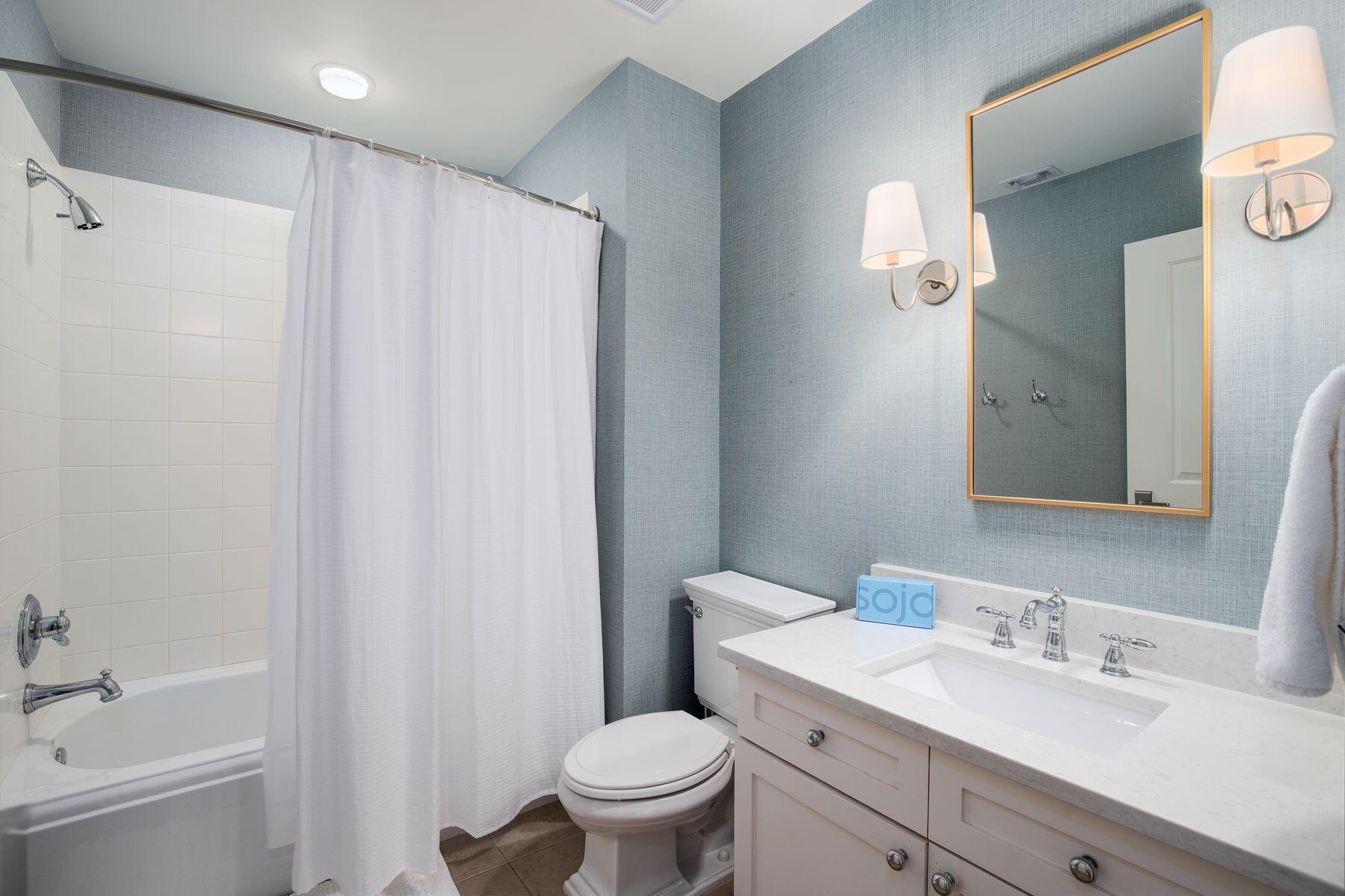 337 Bridge Lane, Unit 312B Watersound, FL 32461 - Photo 17 of 37 a bathroom with a sink a toilet and shower