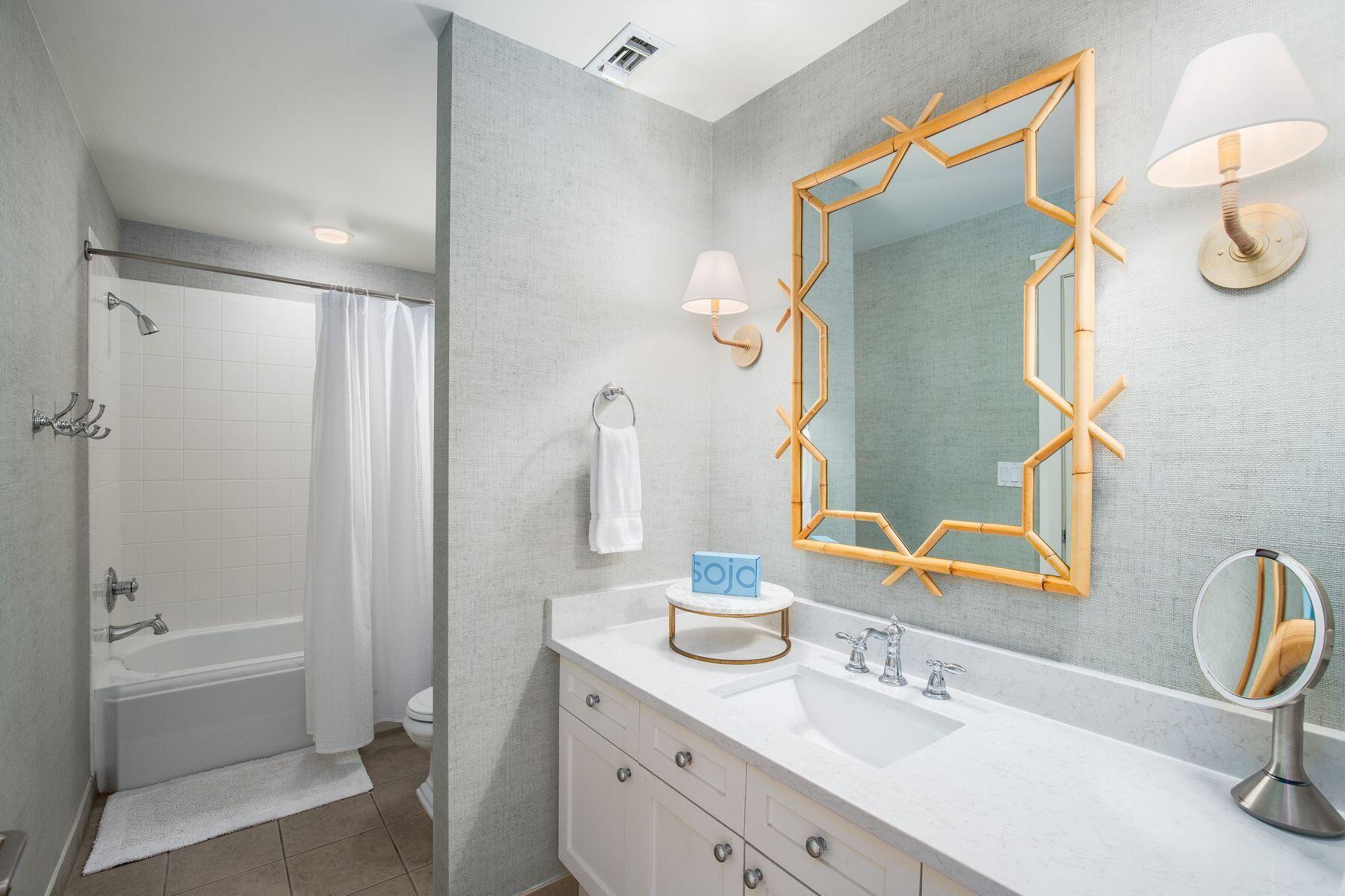 337 Bridge Lane, Unit 312B Watersound, FL 32461 - Photo 20 of 37 a bathroom with a double vanity sink mirror and bathtub