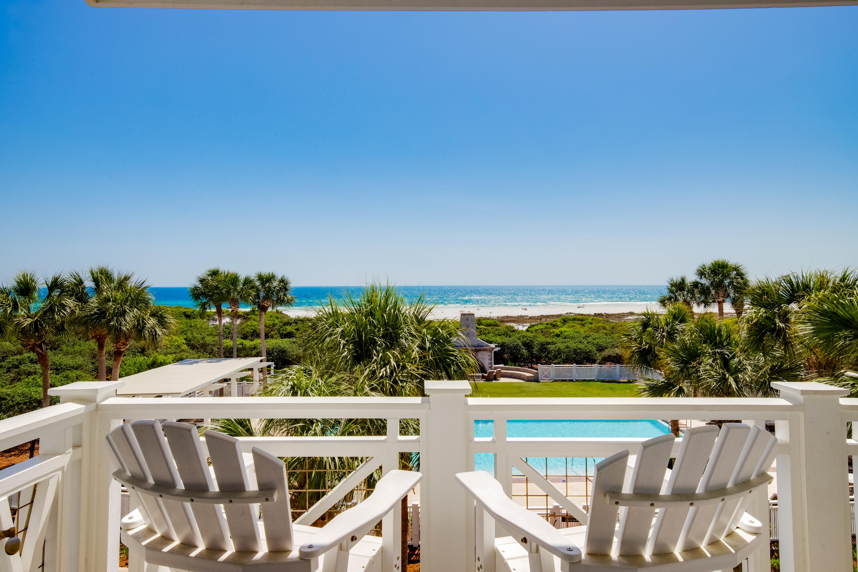 337 Bridge Lane, Unit 312B Watersound, FL 32461 - Photo 2 of 37 a view of a swimming pool with an outdoor seating and a yard