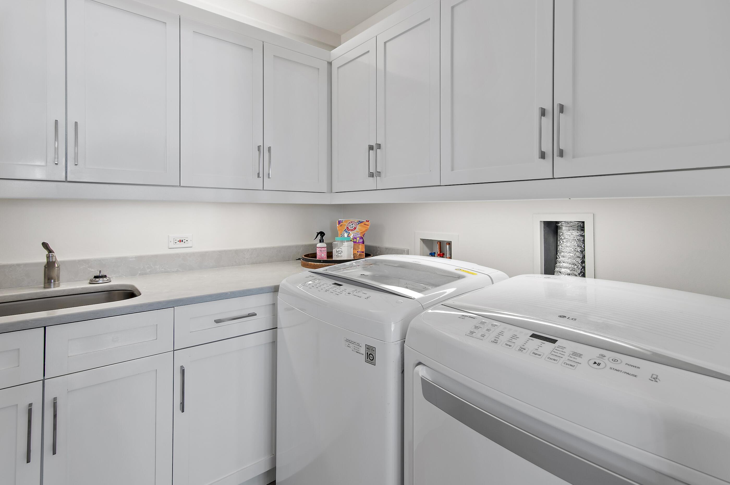337 Bridge Lane, Unit 312B Watersound, FL 32461 - Photo 21 of 37 a utility room with dryer and washer