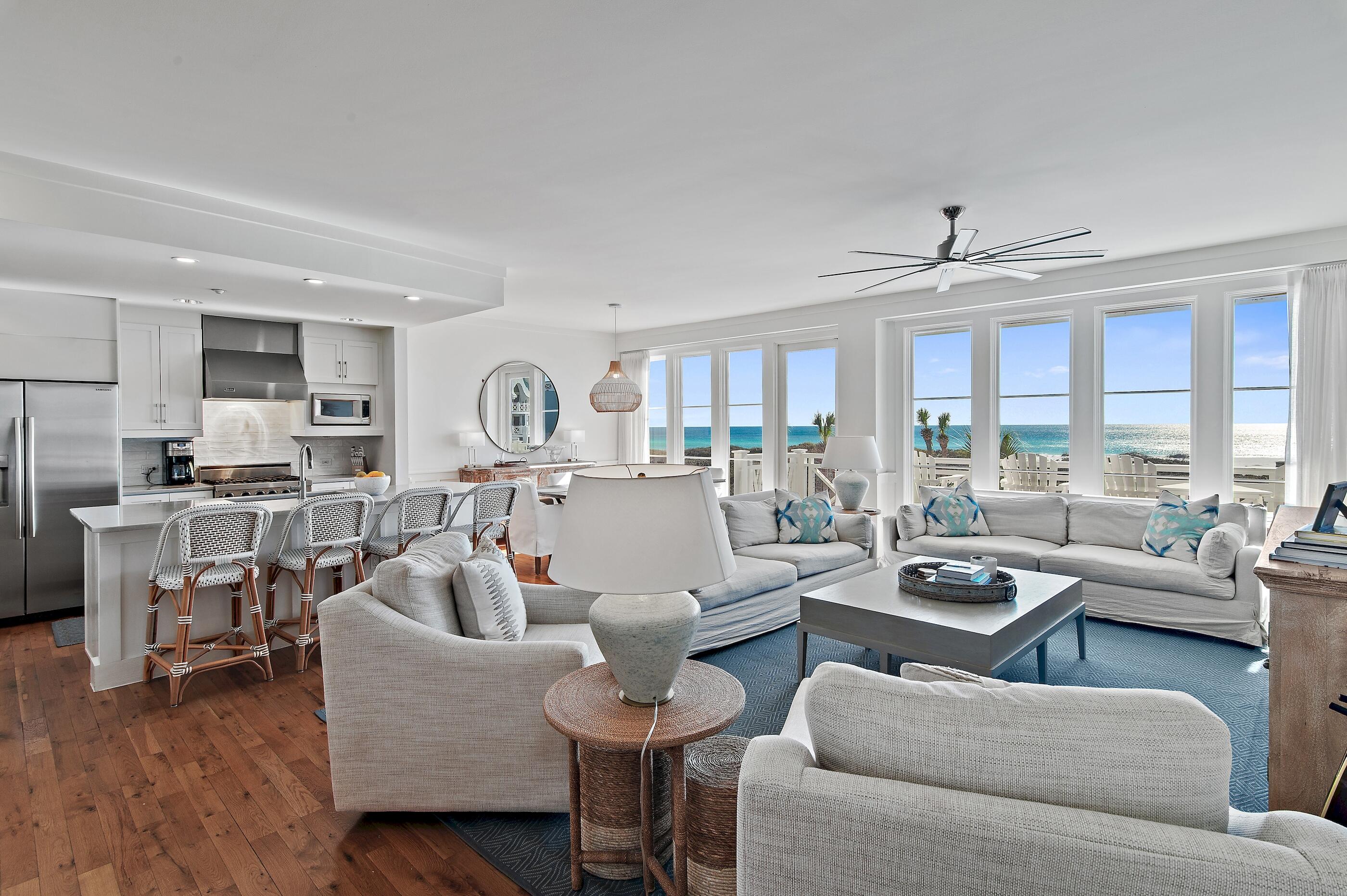 337 Bridge Lane, Unit 312B Watersound, FL 32461 - Photo 3 of 37 a living room with furniture kitchen view and a large window
