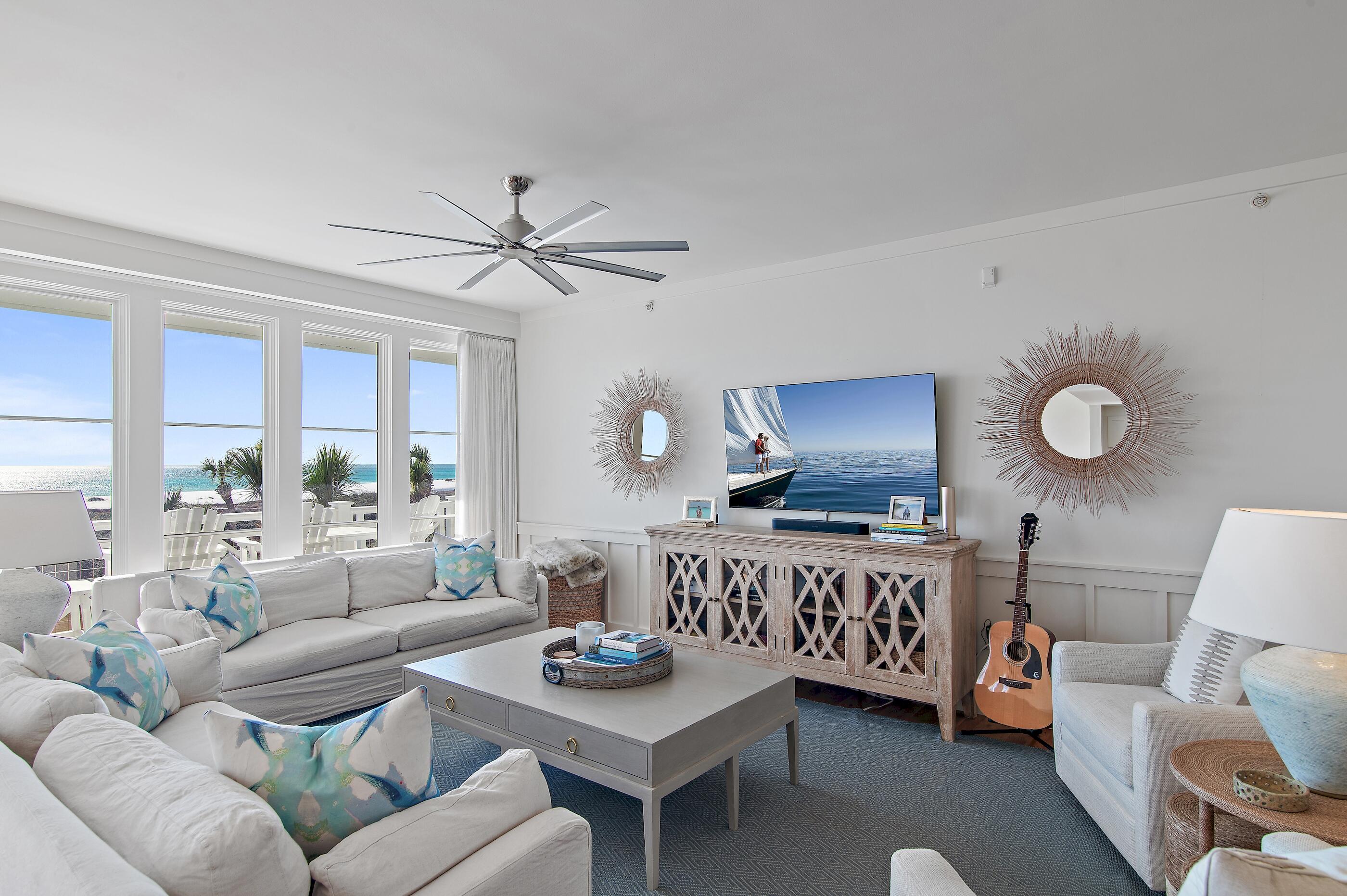 337 Bridge Lane, Unit 312B Watersound, FL 32461 - Photo 4 of 37 a living room with furniture a rug and a large window