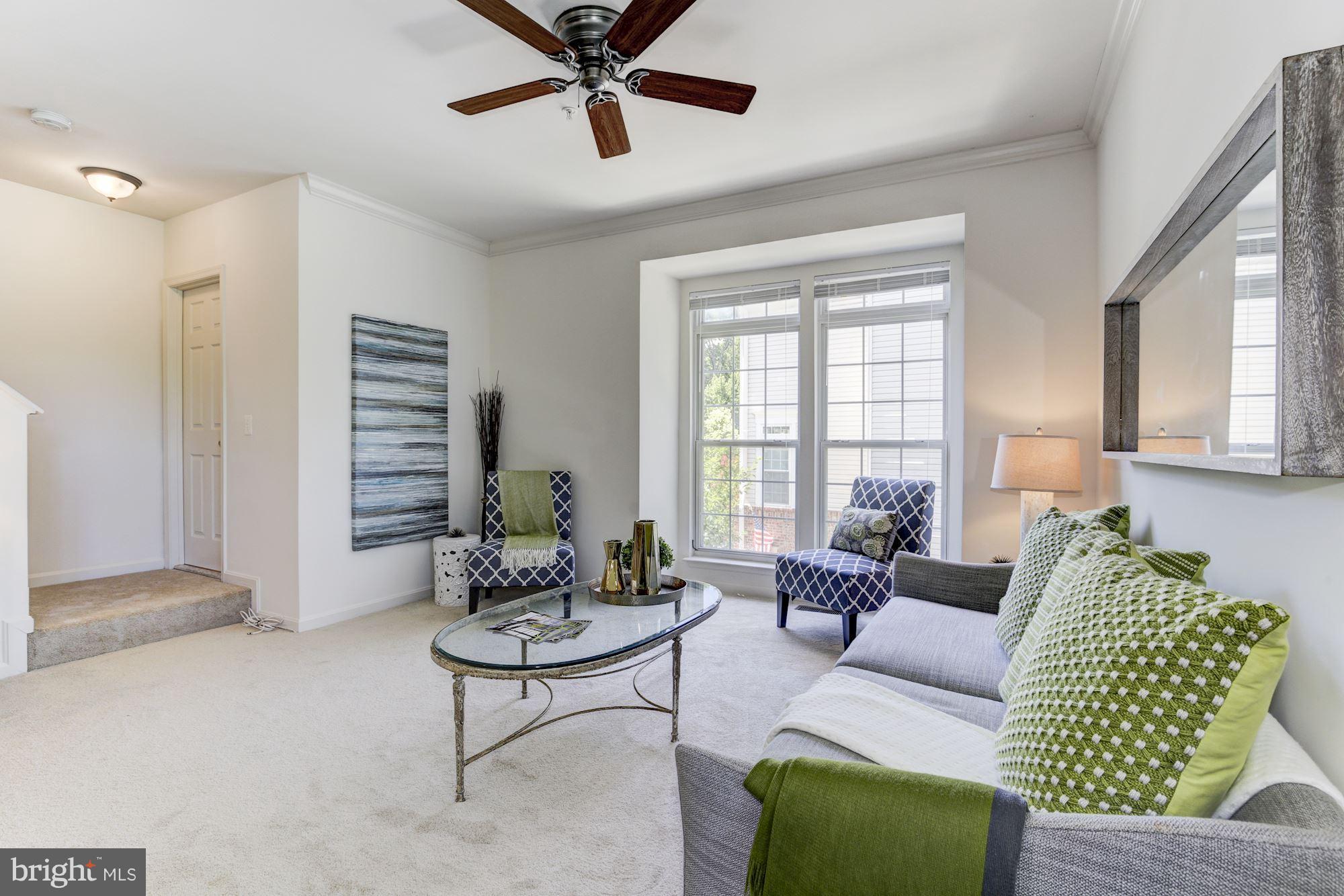 11016 Hemingway Court Silver Spring, MD 20902 - Photo 7 of 28 Living room has ceiling fan and new carpet