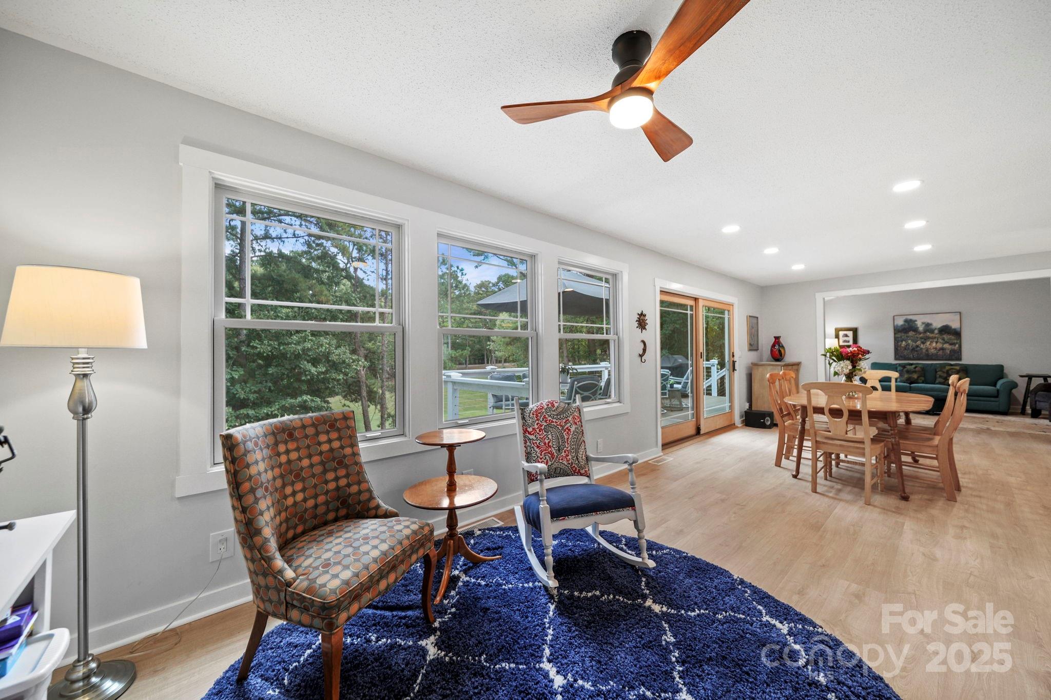 1215 Molokai Drive Fort Mill, SC 29708 - Photo 12 of 25 a dining room with furniture a rug and a large window