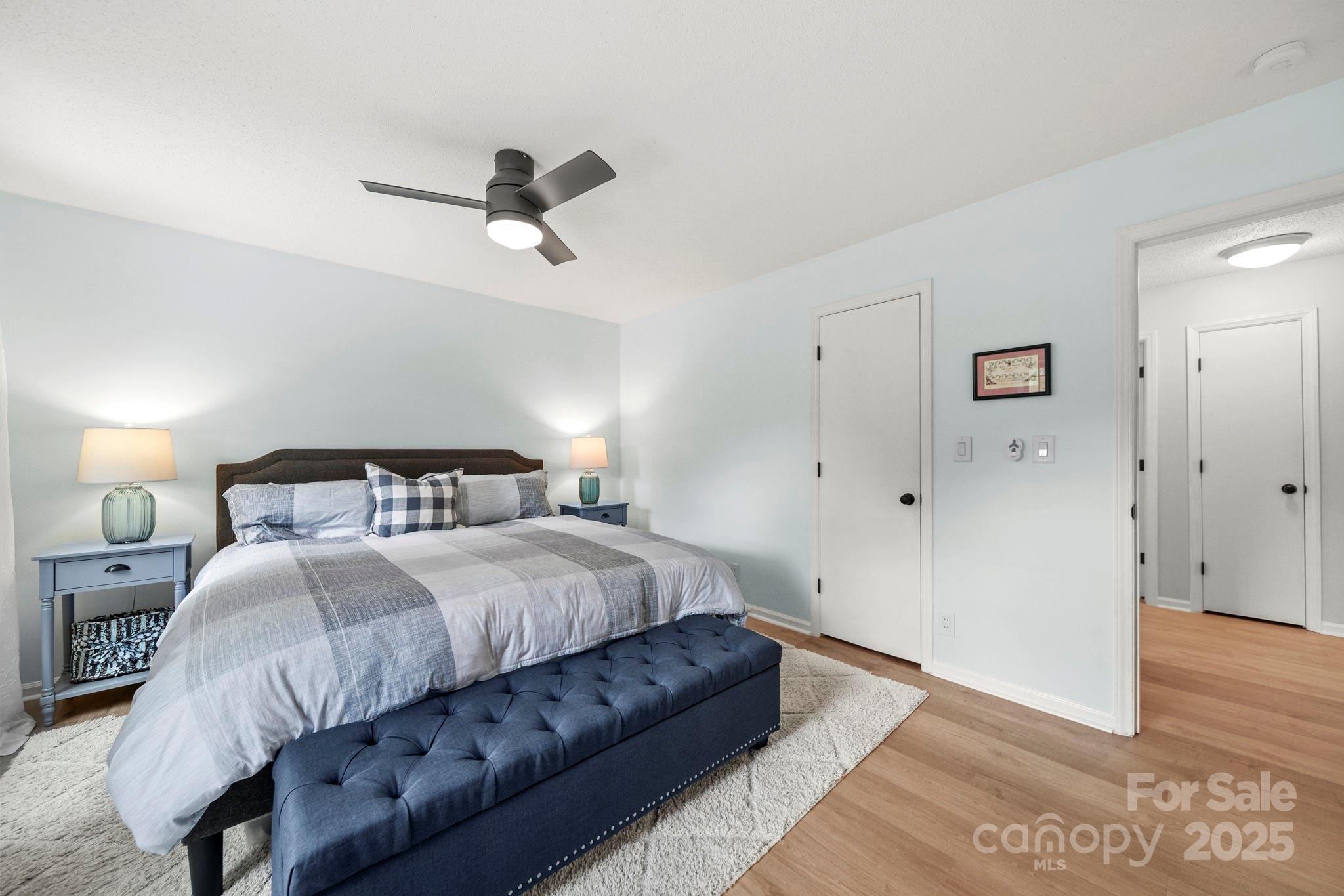 1215 Molokai Drive Fort Mill, SC 29708 - Photo 14 of 25 a bedroom with a bed and wooden floor