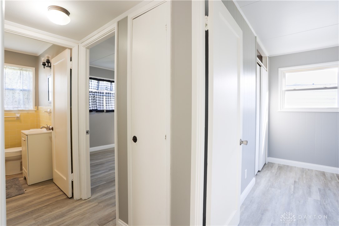 1627 Joselin Road Dayton, OH 45432 - Photo 23 of 28 This interior hallway connects rooms with modern flooring and bright lighting.