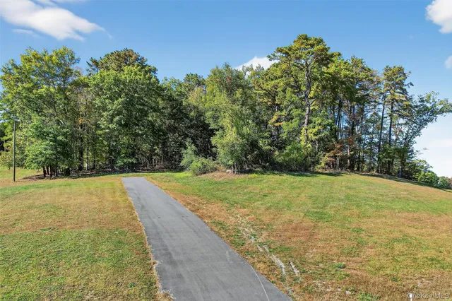 a view of an outdoor space and basketball court