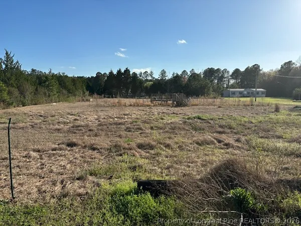 a view of a lake with a yard