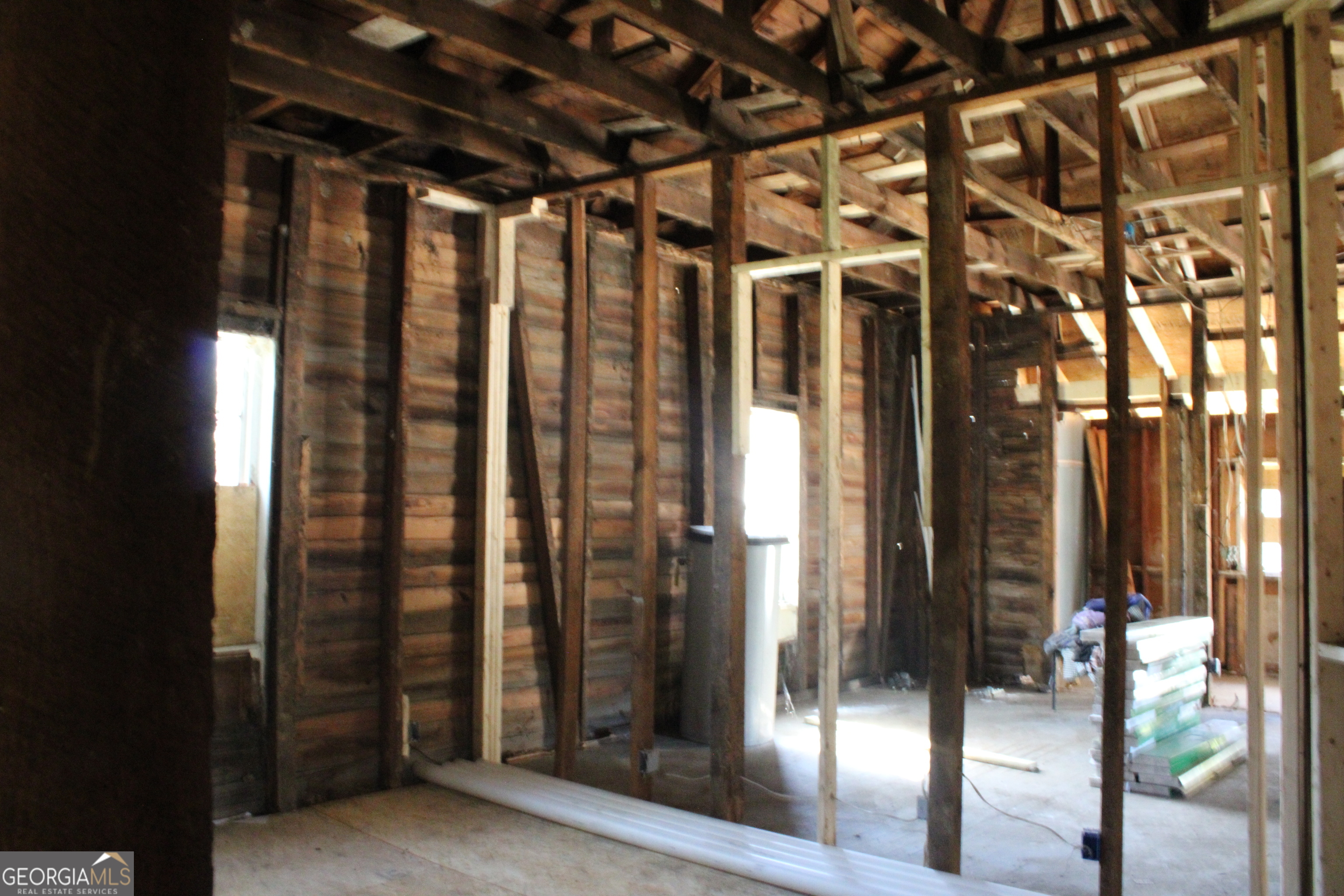 339 Atlanta Street Barnesville, GA 30204 - Photo 15 of 20 a view of a porch with a door and wooden floor
