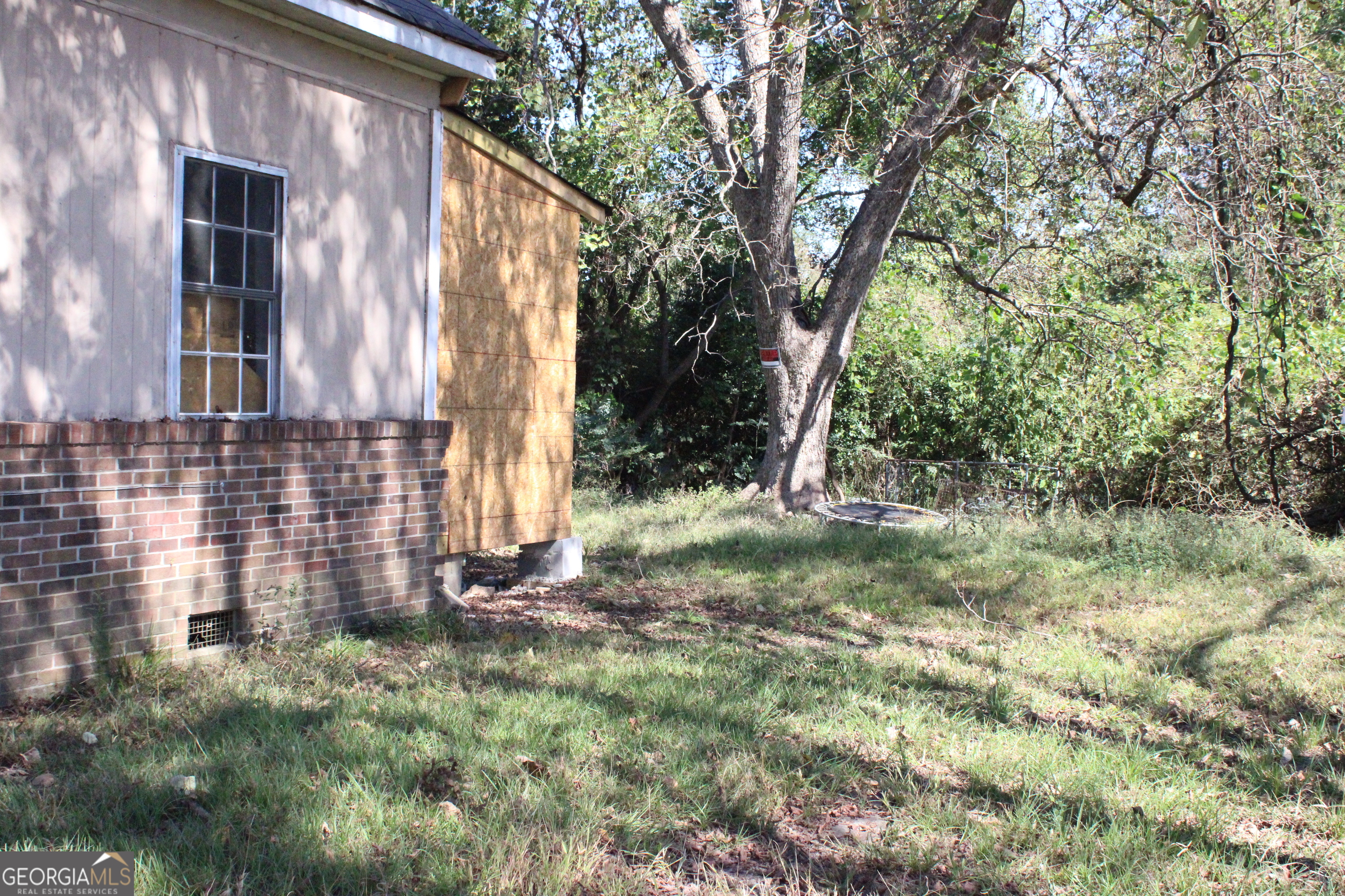 339 Atlanta Street Barnesville, GA 30204 - Photo 18 of 20 a view of backyard with tree