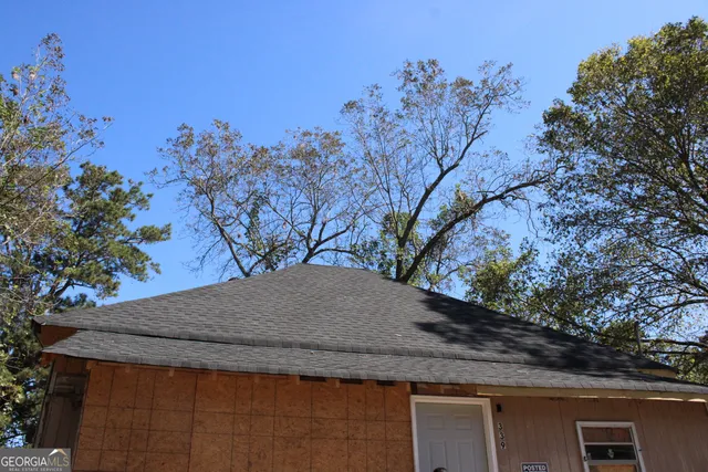 a view of a backyard of the house