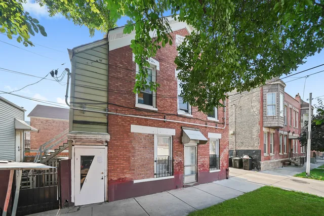 a view of a building with a yard